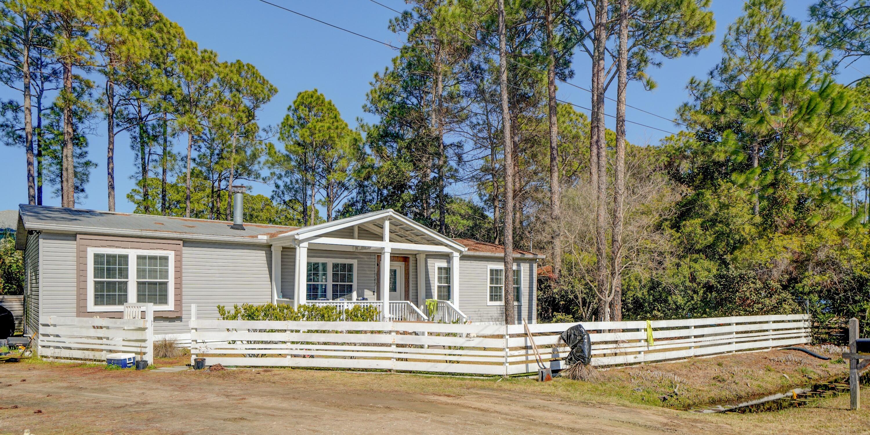Beautifully Updated 3 Bedroom, 2 Bath Manufactured Home
Step inside this spacious and inviting home featuring vaulted ceilings and bamboo wood flooring that create an airy, modern feel throughout. The open‑concept kitchen is a true highlight, complete with an island, white cabinetry, gas stove, walk‑in pantry, recessed lighting, and stylish modern fixtures.
The split bedroom layout includes a generous primary suite with an oversized soaking tub and a large shower, offering a spa‑like retreat. Each bedroom is equipped with a ceiling fan, ensuring year‑round comfort. A versatile bonus area provides the perfect spot for a home office, hobby room, or additional living space. Enjoy peaceful outdoor living with a screened in back porch featuring warm wood beams, ceiling fans, and a cozy fireplace, ideal for relaxing or entertaining. The nicely wooded backyard offers privacy and a natural backdrop, while the detached shed adds convenient storage.
This home blends comfort, charm, and practicality ready for you to move in and enjoy!