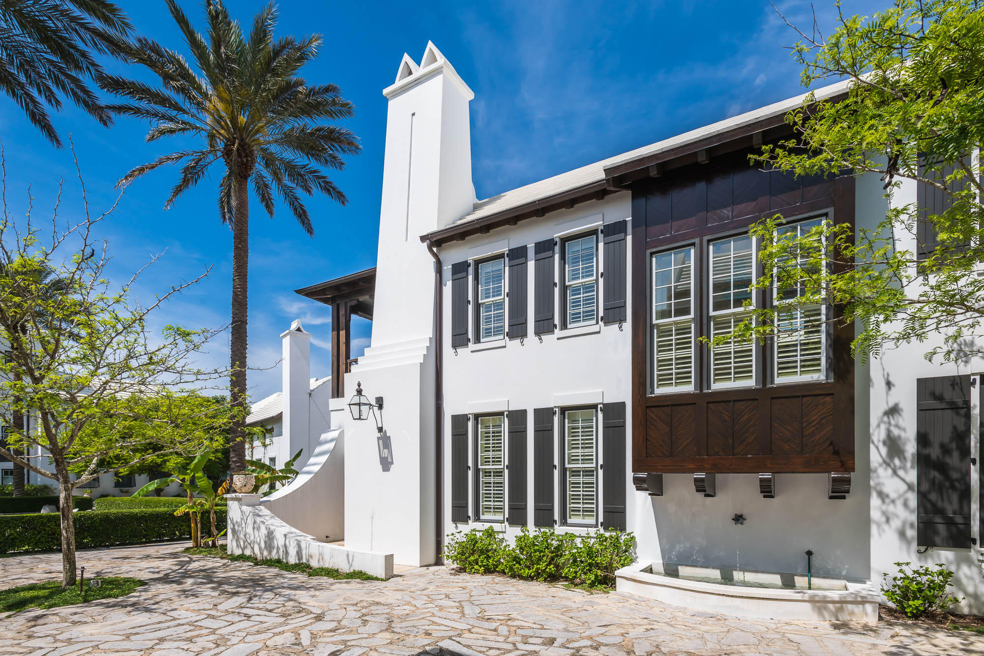 This thoughtfully designed 4 bedroom, 3 -1/2 bath courtyard home is located on a stone pedestrian path and overlooks one of Alys Beach's many green parks. A spacious 3,456 square foot home is situated to capture light and breezes from the outdoor living areas, offering a courtyard and loggia. The kitchen boasts limestone countertops, glass tile backsplash, custom cabinetry, 6 burner Thermador gas range oven, and a banquette breakfast nook. A dining room and living room with fireplace flow from the kitchen, making this area a special gathering place. Peacock pavers have been used throughout the first floor. The palette is neutral, peaceful, and enhanced by elegant trim work, arches and venetian plaster. Stunning Australian cypress flooring is used throughout the second floor. The serene master suite with fireplace is located on the second level. The venetian marble countertops in the master bath compliment the glass tile and set the tone for this elegant bath. A private balcony overlooks the beautifully landscaped park and outdoor fire pit to the Gulf. A popular first floor secondary master bedroom, decorated with glass tile and marble bath, is tucked off the private courtyard. The third and fourth bedrooms are located off a private staircase and share a spacious bath with one having a private balcony.