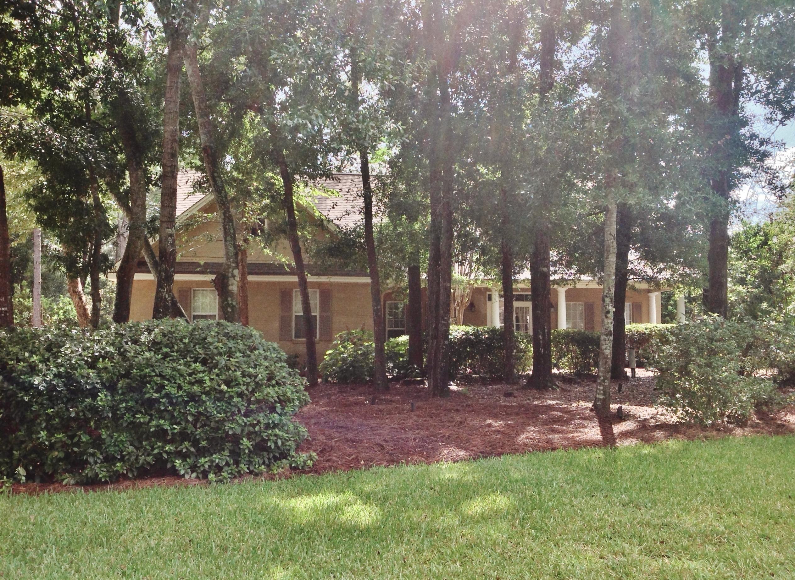 REDUCED FOR IMMEDIATE SALE!
5 bedrooms /3 full baths, Formal Dining Room, Large Living Room, Library/Den with built in bookshelves and Gas FP, Laundry Room with cabinets and long counter top for folding. Master bedroom is down, with his and hers closets.* Her closet is Huge. Slate shower and separate soaking tub in master bath, with large linen closet, private water closet and granite counter top & double vanities. Guest bedroom downstairs on opposite side of home & Guest bath, perfect for mother-in-law, or guests. Floor to ceiling windows & Crown molding. Entire 1st floor is acid stained, scored concrete, similar to the museum floors in Europe. Real Cherry hardwood Floors upstairs. Huge Media Room, 3 bedrooms and & full bath. On large, level .41 acre lot, across from gated park. No carpet, no smoking, allergy friendly home.  Staircase has hand cut, solid cherry Brazilian hard wood floors, installed by an artisan. This is not engineered wood or laminate. A bedroom to right of top of the stairs has a large, walk in closet and its own door to the hall bathroom. The hallway leads to the massive Media  Room wired for surround sound. Plenty of room for a pool table,large flat screen TV or Projector, and still plenty of room for comfortable furniture. There's a 4th bedroom at the opposite end with dormer. From the Media room, a door leads to another little hall with shelves, that is great for storage, and leads to yet another bedroom. This was used as an office at one time. It was originally a walk in attic with a window, but was converted, insulated, heated and cooled, with another walk in closet added. 
The home was 3,667 square feet, and with the heated and cooled 5th bedroom, measuring 15x32, (480 sq.ft.) the total square footage is 4,147. 
This home was built by Andy Beno of Old South Homes. It is a William Poole Southern Design home. 
There's a long, southern style front porch, 2 car, side entry garage, fully privacy fenced backyard. Large covered back porch, pavered, extended patio, once home to a fire pit where the family sat around on cooler nights. This is one of the largest, level lots in Swift Creek at .41 of an acre., backing up to the natural buffer of Rocky Bayou Church and Heritage Gardens. 
It's directly across the street from the gated park with pond, gazebo and dock, where people like to fish and feed the turtles. 
Both A/C's have been replaced. The home was built in 2000, but's it's in excellent condition. I'd love the opportunity to give you a tour.