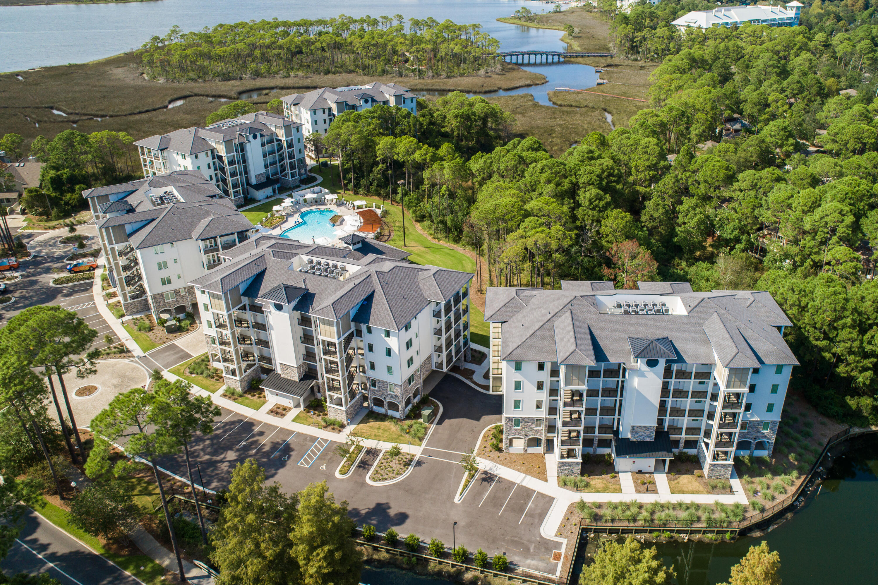 Thoughtfully designed for both comfort and functionality, the residences at Osprey Pointe blend timeless craftsmanship with modern coastal living. Open-concept floor plans feature custom cabinetry, detailed millwork, quartz countertops, GE Profile appliances, and 9-foot ceilings that enhance natural light and effortless flow. Each residence includes a private balcony overlooking serene natural surroundings, offering a peaceful connection to Sandestin's bayside landscape. Ownership at Osprey Pointe delivers a true resort-style lifestyle. Listing represents a specific floor plan available across multiple units. Finishes, views, and availability may vary. Residents enjoy a zero-entry pool, a 12-foot hydrotherapy spa, an on-site fitness center, and expansive landscaped lawn areas ideal for relaxation and gathering. Additional conveniences include assigned covered parking, optional golf cart parking with charging stations, and 24-hour on-site resort management for ease of ownership.

Located within Sandestin Golf and Beach Resort's Bayside community, Osprey Pointe is centrally positioned near The Village of Baytowne Wharf and offers convenient tunnel access to the private Gulf-front beach. Rental-friendly and professionally managed, the community is well suited for full-time residents, second-home owners, or buyers seeking both short- and long-term rental opportunities within one of Northwest Florida's most established resort destinations.

As an introduction to the Sandestin lifestyle, we invite our new owners to explore amenities that make Sandestin special. The listing brokerage and seller(s) are presenting the buyer(s) of this property with (2) 90-minute rounds of Tennis court time, a golf foursome at one of our three championship courses, and a round of golf for up to four (4) players at the unrivaled Burnt Pine Golf Club. 

Sandestin Golf and Beach Resort features more than seven miles of beaches and pristine bay front, four championship golf courses, 15 world-class tennis courts, a 226-slip marina, a fitness center, spa and celebrity chef dining. Shop, dine and play at the charming pedestrian village, The Village of Baytowne Wharf and more. Inside the gates of the resort, residents enjoy a balanced lifestyle of high-class living, spanning the 2,400 acres from the beach to the bay. Everything within the gates of the resort is accessible by golf cart or bicycle. The entire resort is interconnected by miles of pedestrian, bike and golf cart paths that weave through groves of live oaks, meandering past natural lagoons, fountains, man-made lakes, and meticulously landscaped fairways.