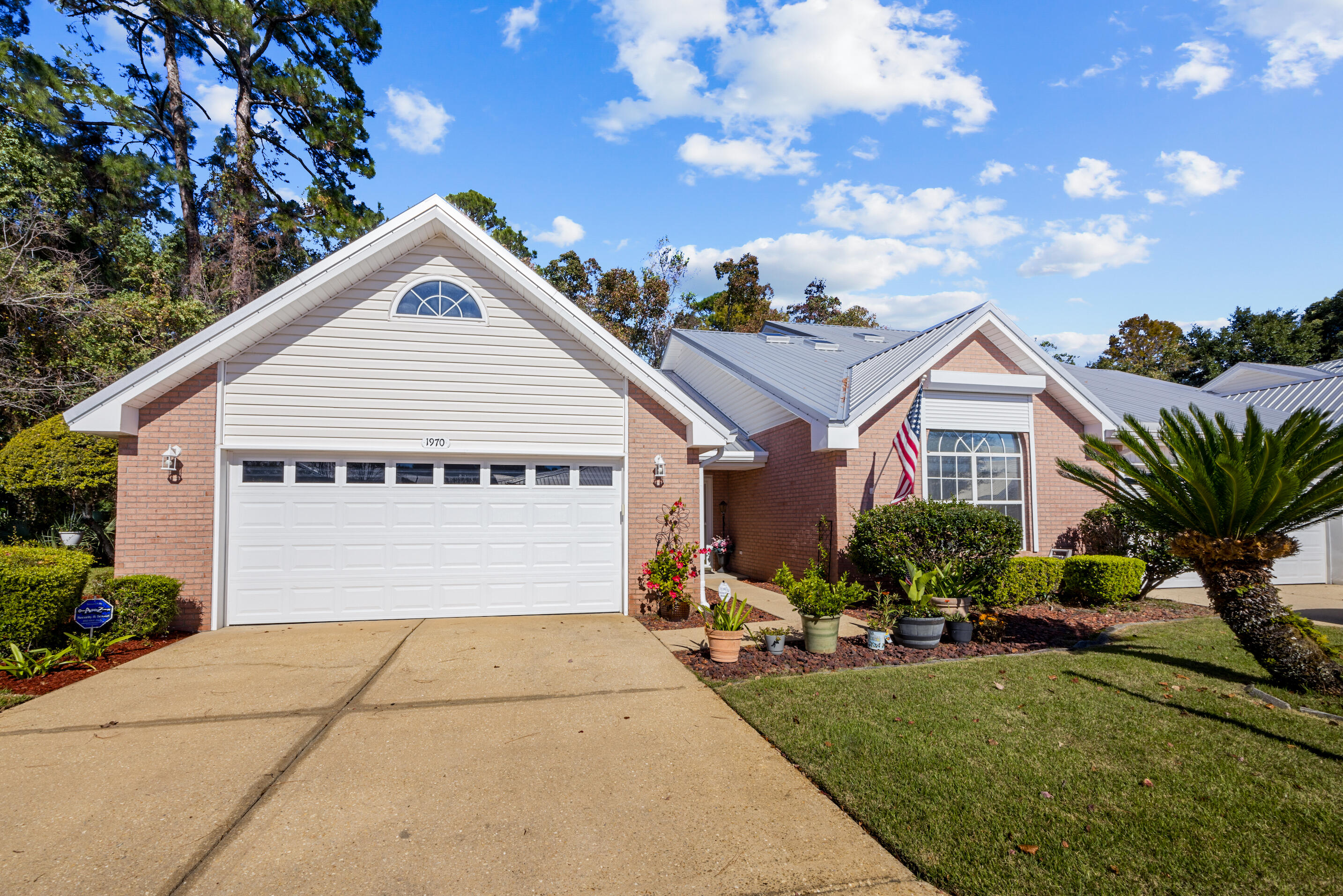 Welcome to this spacious all-brick, one-story end unit townhome located in a peaceful cul-de-sac, offering the perfect blend of comfort and convenience. With 3 bedrooms and 2 bathrooms, this home features a metal roof installed in 2018, ensuring durability and peace of mind. The property boasts a 2-car garage and an enclosed back porch that overlooks a serene preserve, creating an ideal retreat for relaxation.

Inside, you'll find a beautifully landscaped home with a whole-house beam vacuum system, tile and carpet flooring, and elegant tray ceilings. The kitchen is a true highlight, featuring granite countertops, a breakfast bar, built-in desk, and a spacious pantry. Sliders from both the breakfast nook/dining area and living room lead out to the private porch, inviting natural light to fill the space.

The master suite offers a separate shower and garden tub, providing a luxurious retreat. Additional features include window treatments, a front storm door, and hurricane shutters for added protection. The HOA takes care of lawn maintenance, allowing you to enjoy a low-maintenance lifestyle.

This home is located in a no-thru-traffic neighborhood, ensuring a quiet and safe environment. Don't miss your chance to make this beautifully maintained townhome your own!