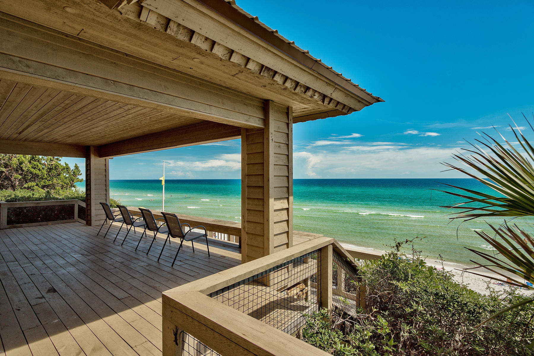 The year was 1974. The Brady Bunch was on TV, Gerald Ford was in the White House and the Peddle family of Oxford, Mississippi had just purchased a large parcel of gulf-front land in the middle of nowhere  between the sleepy fishing village of Destin and popular Panama City, Florida.
Dense with native oaks, magnolias and stocky green palmettos, they named the property Little Oaks. They drew up plans for what was, at the time, a wildly modern home and sited it on a breezy, 30-foot bluff overlooking the Gulf.
The Peddle home was completed in 1975. A lush courtyard greeted guests and led them through a set of heavy, carved doors and into the cool interior. An open living area, featuring a freestanding stone fireplace and chimney, cedar beams and brick floors was perfect for entertaining. A spectacular wall of windows looked onto a covered deck that ran the length of the home and provided views of the turquoise water below. A private boardwalk dropped enticingly to the sugar-white sand.

Today, the Peddle estate remains virtually untouched by time, a tranquil oasis hidden among the hustle and bustle of Scenic Highway 30A. The sheer size of this parcel and the desirable "pivot" location make it an unheard of find in the area.

So now the question is: what would you do with Little Oaks? Live in the existing family home, enjoying the thick buffer of vegetation and Gulf-front views, or build your very own legacy home from the sand up?

Few properties like Little Oaks exist anymore. Those times are gone - but this opportunity is real and present. This is truly the kind of parcel that dreams are made of. We are here to help you solidify your offer to purchase this property. Contact us today!