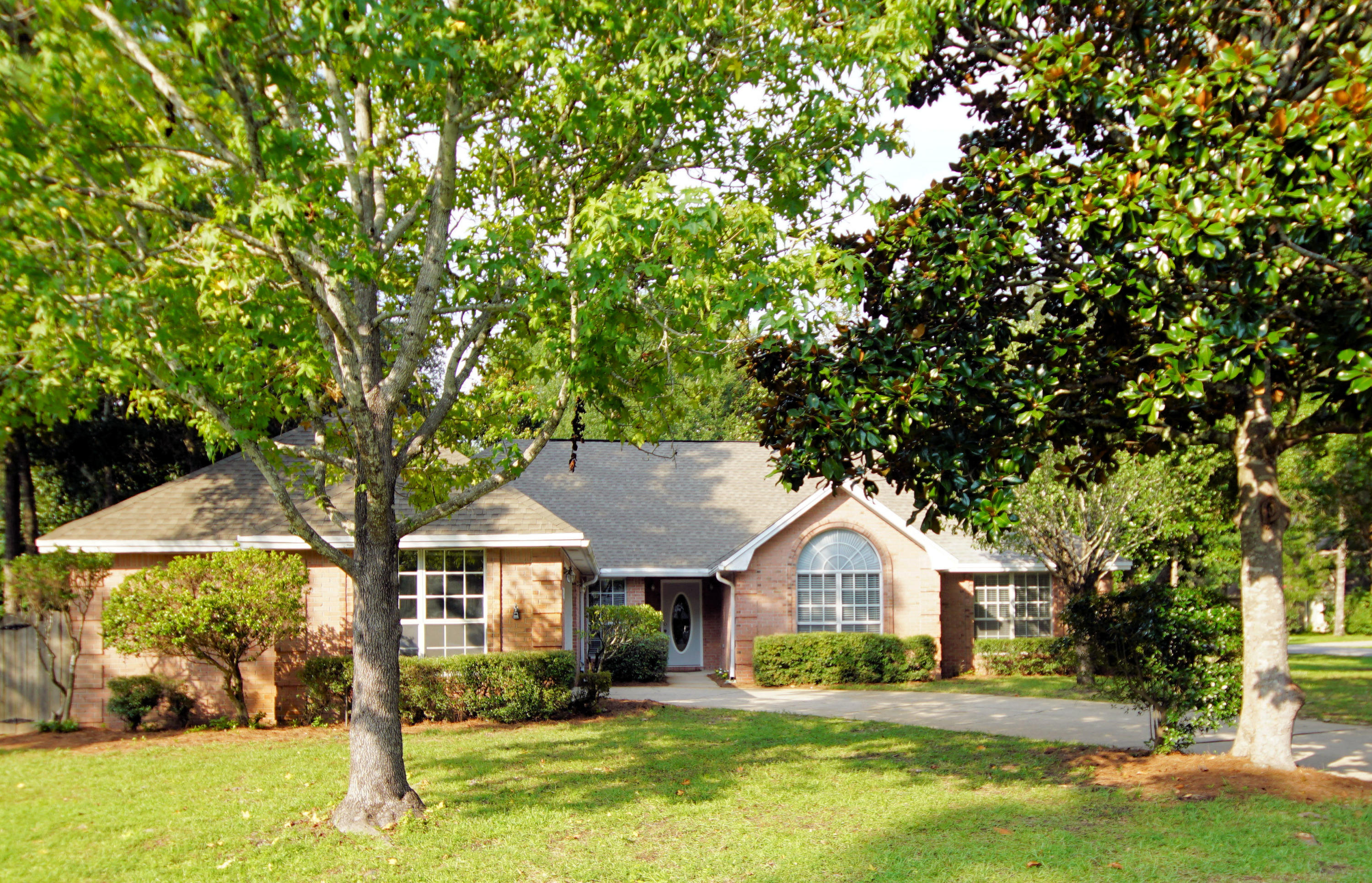 Wonderful Windward home on a private .43 acre corner lot in the community of Bluewater Bay. This home is light and bright with high ceilings and an open floorplan featuring two living areas. When you enter through the wide foyer, you will find the dining room to the left and the living room straight ahead. Adjoining the living room is the family room that is open to the large kitchen and breakfast area. The good sized bedrooms are located on the other side of the house for maximum privacy. This home has been freshly painted, the carpet is only a year old and there are new stainless appliances in the kitchen. The large, fenced corner lot with a double gate is great for both kids and pets and would be perfect for a future pool. This home in the private gated community of Windward featuring a private bayfront beach is in move in condition and is sure to please its new family!