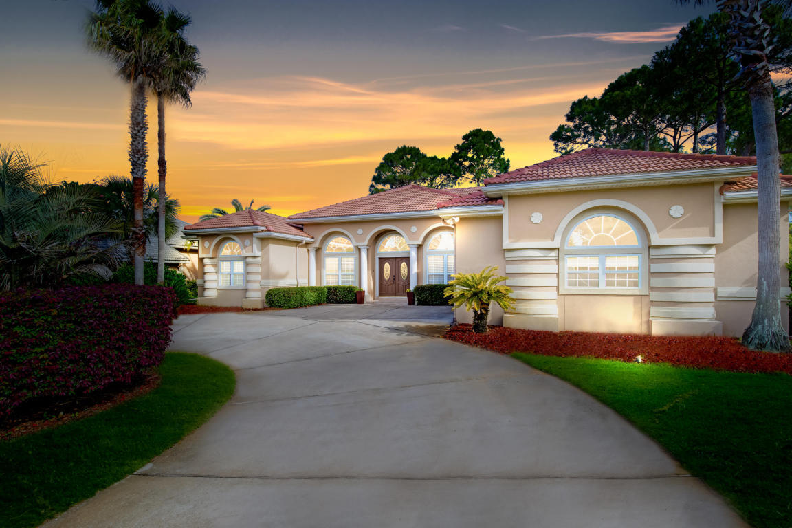 Gorgeous views of the prestigious Emerald Bay 11th fairway overlooking the green awaits you from this pristine custom built home! Click on the photos and discover this home's unique design elements with intricate ceilings, a large enclosed rear porch, new tile in the Master Bath, and beautiful crown moulding. New stainless steel appliances adorn the kitchen, and a newly installed high efficiency HVAC system is in place for the buyers ''Peace of Mind''. Relax...you'll be living in a great, gated Golf Course Subdivision with a nicely kept community pool, tennis courts, and a very affordable HOA Fee. The Beach and Emerald Green Waters of the Gulf are less than six minutes away as well as an outstanding selection of restaurants, great shopping and live entertainment.
