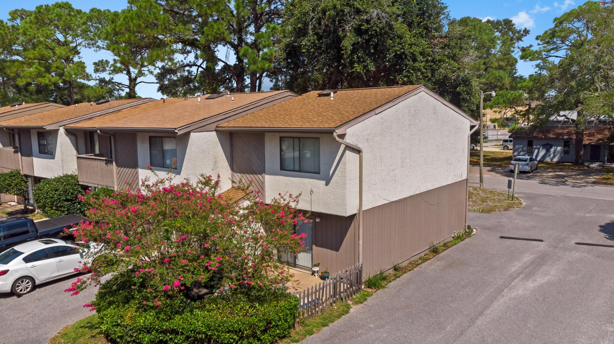Perfect for a primary residence or an investment property with a month to month tenant already in place! Have peace of mind with a brand new roof (installed September 2021 with a 10 year warranty), a water heater just installed July 2021, and a 2010 HVAC! Located in the heart of Fort Walton Beach you'll love being walking distance to downtown and just a few minute drive to the Emerald Coast's gorgeous white sandy beaches! Downstairs you'll find a kitchen open to the large tiled living room, and also downstairs is a full bathroom. Upstairs you'll find two spacious bedrooms with ample closet space, and a full bathroom complete with a closet housing washer and dryer hookups. The master bedroom has a large balcony overlooking the front of the property, and the back patio is an adorable fenced in space complete with an outside storage closet. HOA fees are only $50/month and include a sparkling pool for community use! Don't delay on this fantastic find!