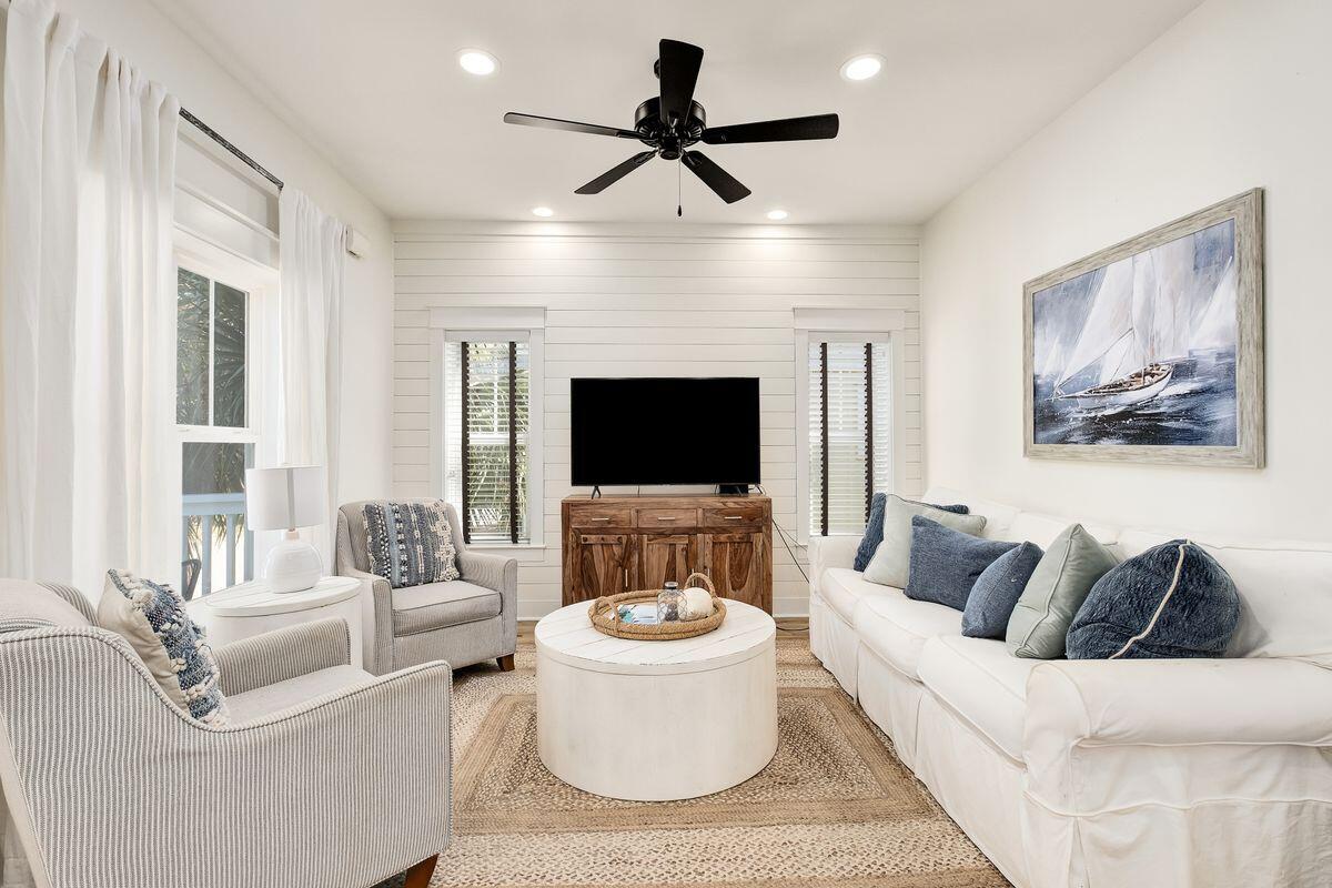 Three stories of updated beach living are offered right here at Satinwood Place. Located at the end of a quiet residential street just off Scenic Highway 30A, this lovely home is conveniently close to white sandy beaches on the beautiful Emerald Coast. The home has been well-maintained and has new furniture, upgraded bathrooms and flooring and new light fixtures so there's no ''to-do'' list. A paved driveway leads to a two-car garage. There's a connecting door to the mudroom and plenty of storage on this level. Head upstairs to the main living area where new wood-effect flooring flows through the bright and spacious family room. There's also a guest bedroom/ bunk room with an en suite bathroom. The well-planned chef's kitchen has ample white cabinetry complementing the stainless appliances and black granite countertops. Recently updated, the kitchen has shiplap accents that reappear in the living room and master bedroom. Perch at the breakfast bar for casual meals or dine as a family in the separate dining area. Doors open onto the balcony providing fresh breezes and outdoor space for enjoying icy drinks at sunset. The top floor accommodates the attractive master suite with ample closet space and an airy vaulted ceiling. There's an adjoining bathroom with a spacious walk-in shower and a private balcony for quiet escapes with a bestselling novel. With no HOA, this coastal hideaway makes a beautiful vacation home or rental investment close to Gulf Place shops and restaurants. Recent improvements to the property include a new water heater, new interior and exterior paint, new lighting, new LVP flooring, a master bathroom remodel including new tiled shower and glass, updated landscaping and new furniture and beds throughout. It currently grosses $78,000 with some owner use during peak season. White sandy beaches and warm gulf waters are just a half-mile away and Draper Lake offers kayaking, paddleboarding and bird-watching.