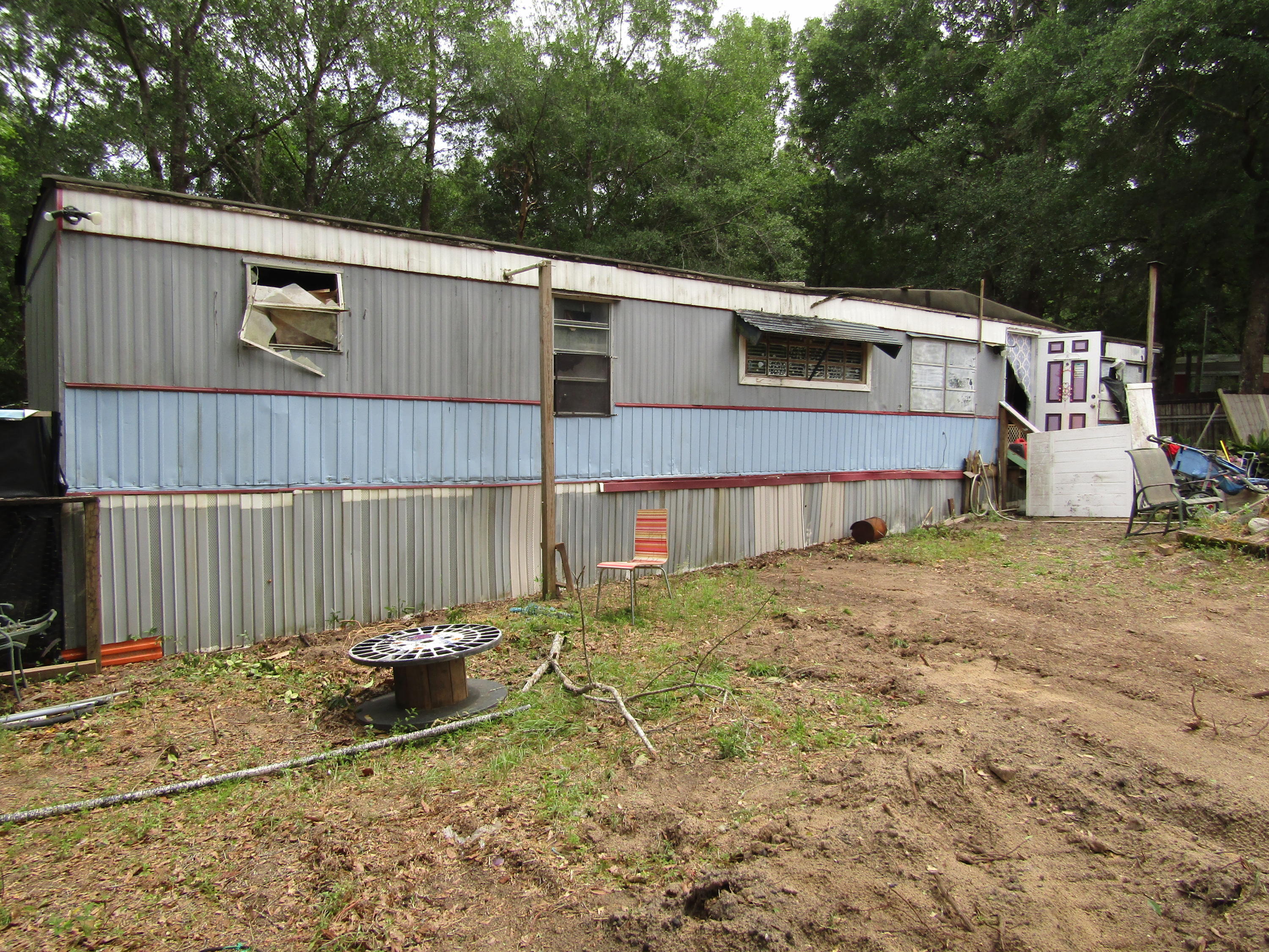 INVESTOR SPECIAL! Check out this almost half acre corner lot on with a Trailer. Trailer needs a lot of work, but could turn into a great cash flowing property. Call us to schedule a showing today!