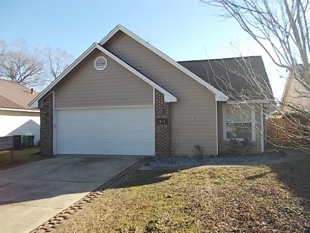 This beautiful home is centrally located in Fort Walton Beach within close proximity to both Eglin and Hurlburt AFB's. This home features 3 bedrooms and 2 baths, 2 car garage and a large open deck. All appliances in kitchen have been replaced, most of the interior has recently been painted, new carpet has been recently installed in the bedrooms and the exterior was painted in 2017 and most of the exterior siding has been replaced with Hardi Board. The family room is open with a brick fireplace with mantle and hearth and flows nicely with the kitchen and dining area. Off the dining area is the large open deck perfect for grilling and entertaining. This is a cozy, well maintained home in a good, central location.