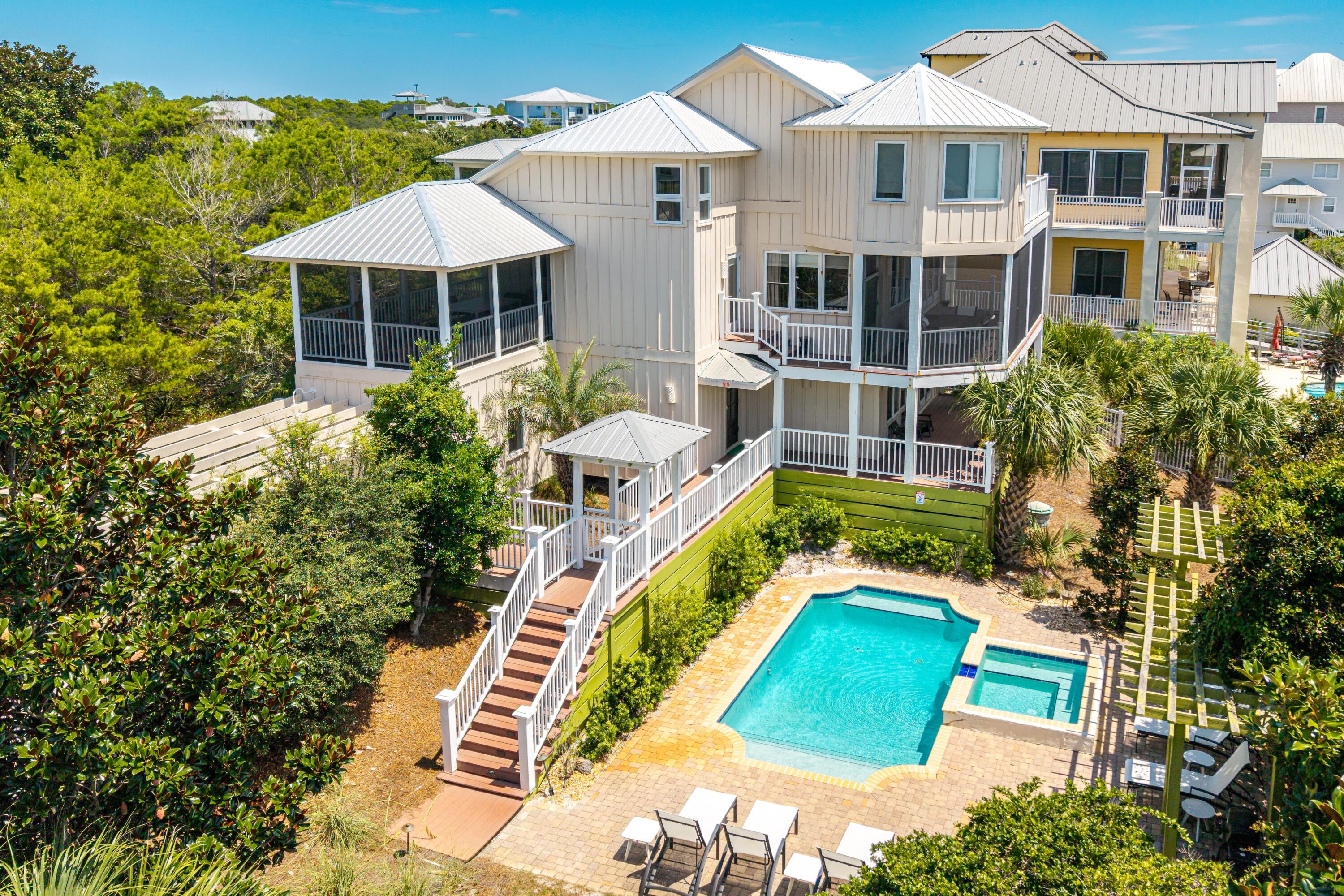 Discover the perfect blend of luxury living and rental income potential in this custom-designed beach home, offering unmatched versatility as a vacation rental, second home, or primary residence. Enjoy exclusive access to the private Gulf Pines beach,  with over 1,365 linear feet, providing a serene and secluded coastal experience just steps away. With over 3000 sq ft of heated/cooled living space and 500+ sq ft of outdoor porches and decks, this property is designed to accommodate large families or groups with ease. The ground-floor suite is ideal for short-term rental guests or multi-family use, featuring two bedrooms, two baths, a sitting room, office space, and a kitchenette. 
The second level showcases an open-concept great room with stunning Gulf views, wide board wood floors, a cozy fireplace, and a gourmet kitchen equipped with solid surface countertops and stainless steel appliances. A guest bedroom and bath complete this level. 
The top level is a private master retreat, boasting vaulted ceilings, a sitting area/study, a spa-style bath with a soaking tub and marble tile, and a walk-in closet with built-ins.

Premium features for renters and owners alike:
*   9' ceilings, solid wood doors, and wide wood flooring
*   High-end windows and doors, plus a Bose surround sound system indoors and out
*   Spacious screened porches and sun decks on every level
*   Oversized lot for added privacy and space
*   Exclusive access to the private Gulf Trace beach, enhancing the coastal lifestyle

Whether you're seeking strong ROI through rental income or aiming to embrace coastal living at its finest, this home delivers exceptional value in a high-demand beachside location. 

Call today to schedule your private appointment and experience the luxury of Gulf Pines.