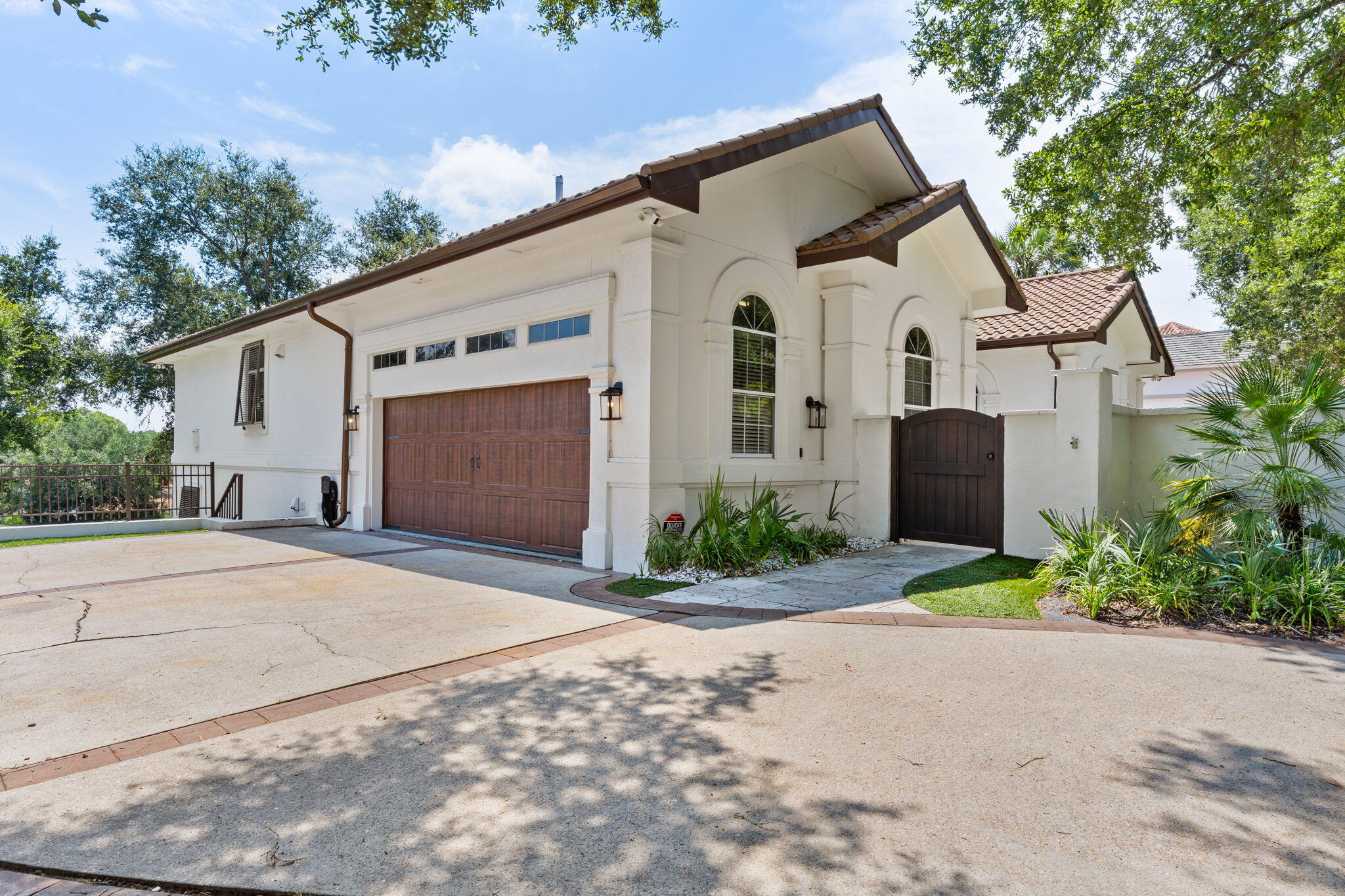 Located on the coveted beachside of Sandestin Golf & Beach Resort, this charming golf course home blends luxury, comfort, and convenience in one exceptional package. A gated front courtyard with elegant lighting and a tranquil wall fountain sets the tone before you step inside to an expansive open floorplan. High-end furnishings, coastal-inspired decor, and abundant natural light create a serene yet sophisticated atmosphere. 
The chef's kitchen is a showstopper—featuring commercial-grade appliances, a 9' quartzite island with built-in wine fridge, pot filler over the gas range, and a stunning backsplash that pairs perfectly with the quartz countertops. Enjoy peaceful mornings or relaxing evenings on your private screened lanai overlooking the 13th fairway of Baytowne Golf Course, complete with a four-person Marquee spa. With three living areastwo on the main level and one downstairsthis home offers incredible versatility for guests or multigenerational living. A private 2-car garage provides ample storage and parking, and the included golf cart makes exploring the resort effortless. Recent updates include fresh interior paint, designer light fixtures, and new furnituremaking this home completely turnkey.
Situated in the desirable Tivoli Ridge neighborhood, you'll enjoy a private community pool for a more secluded swim. As a Sandestin resident, you're just minutes from pristine beaches, the marina, Baytowne Wharf, Grand Boulevard's shopping and dining, world-class golf, tennis, and the resort's aquatic center.
Meticulously maintained and move-in ready, this home delivers the ultimate Sandestin lifestyle. Schedule your private showing today!