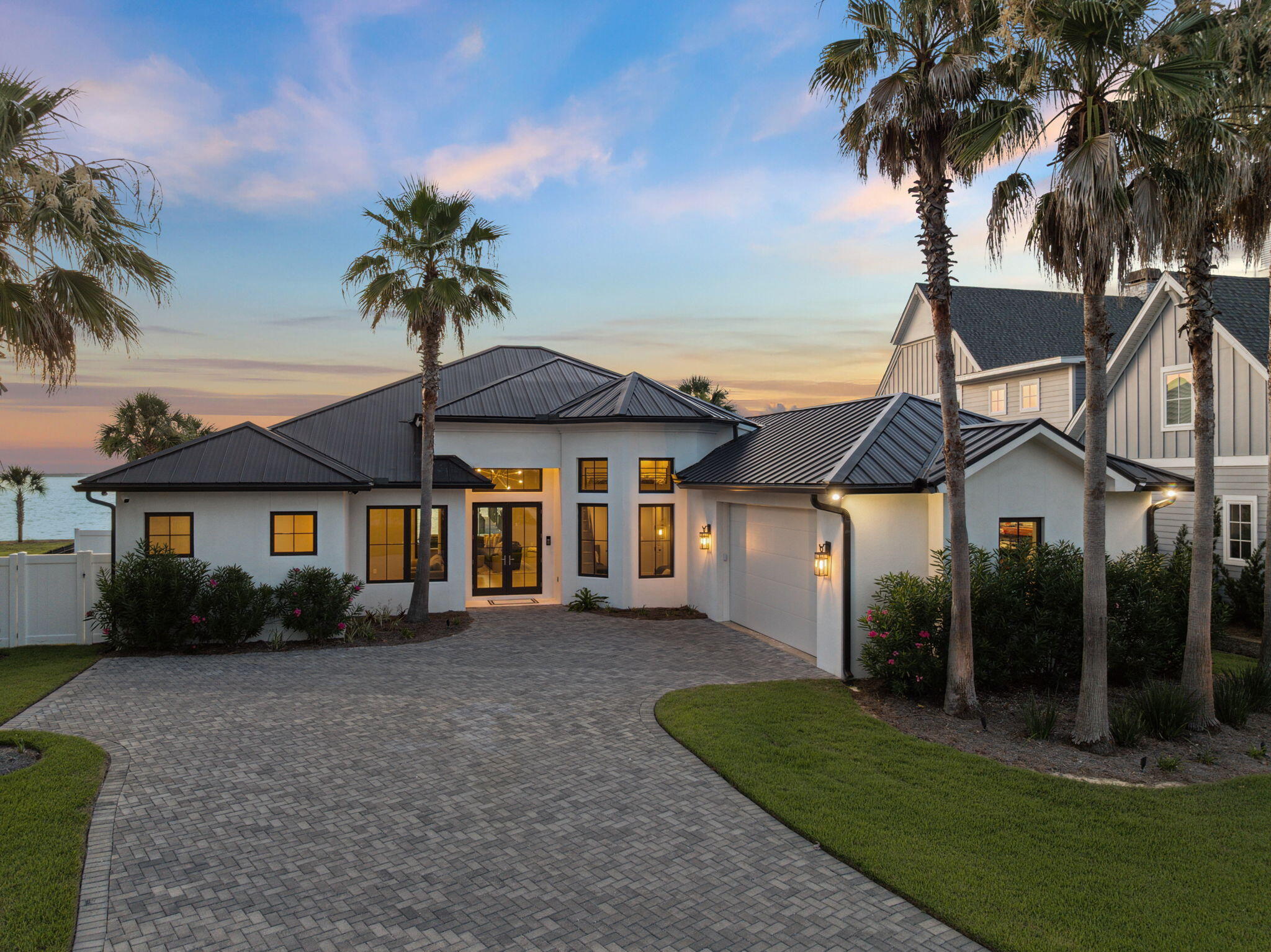 A waterfront location - perfected! Situated on a pinnacle lot on the prestigious Four Mile Point along Greater Driftwood Estates, 31 Driftwood Court stands as an epitome of elegance and modern luxury with panoramic views of the Choctawhatchee Bay. This magnificent one-level waterfront estate, freshly reimagined through an extensive renovation completed between 2021 and 2022, offers an expansive living space encompassing 3028 square feet heated and cooled, on 0.73-acre meticulously landscaped lot, with 113 feet of prime bay frontage.

Upon entering, you are welcomed into a world of refined, yet modern sophistication. The home boasts five spacious bedrooms and four full bathrooms. The entire residence was meticulously restructured, retaining only its original concrete block ex terior walls, concrete slab, and roof trusses. Every other element, from new framing to a state-of-the-art geothermal HVAC system, was crafted anew to ensure comfort, style, and efficiency.

Luxury abounds with Wolf and Sub-Zero appliances gracing the kitchen, complemented by new cabinetry, countertops, and fixtures that reflect the highest standards of design. Modern lighting throughout. The living spaces are adorned with curated Restoration Hardware furnishings, providing an ambiance of comfort and style.

The primary waterfront suite, an enclave of tranquility, offers a private retreat with expansive views, complemented by an elegant en-suite bathroom. Each additional bedroom and bath is thoughtfully designed, ensuring privacy and comfort for family and guests alike. An additional waterfront bedroom/bath is the perfect space for a guest suite or private office, together with 3 further bedrooms, one with an extra elevated sleeping loft.

Step outside to discover a private oasis. The newly installed heated pool, surrounded by pristine pool pavers, promises countless days of leisure and enjoyment. The outdoor space is beautifully reimagined with entirely new landscaping with professional lighting connected to the home's automation system.

Noteworthy features include direct deep water access with a new 20,000 lb boat lift and dual jet ski lifts, perfect for aquatic adventures. The seawall and rip rap were replaced and elevated by 18 inches.

New pristine white stucco on exterior, all-new high impact-rated storm windows and doors, and a 2022 metal standing seam roof provide peace of mind. The integral garage, with its increased 9 ft height and insulated doors, provides ample space and convenience. The property has a new state-of-the-the-art geothermal HVAC system, upgraded 400 amp electrical system, new water heater, and full house automation system ensuring it's a smart home monitored and controlled from any location; perfect as a primary or second residence.

31 Driftwood Court is more than a waterfront home; it's a statement of luxurious living, offering the perfect balance of elegance, modern convenience, and breathtaking natural beauty. Experience life at its finest in this extraordinary Santa Rosa Beach waterfront sanctuary.