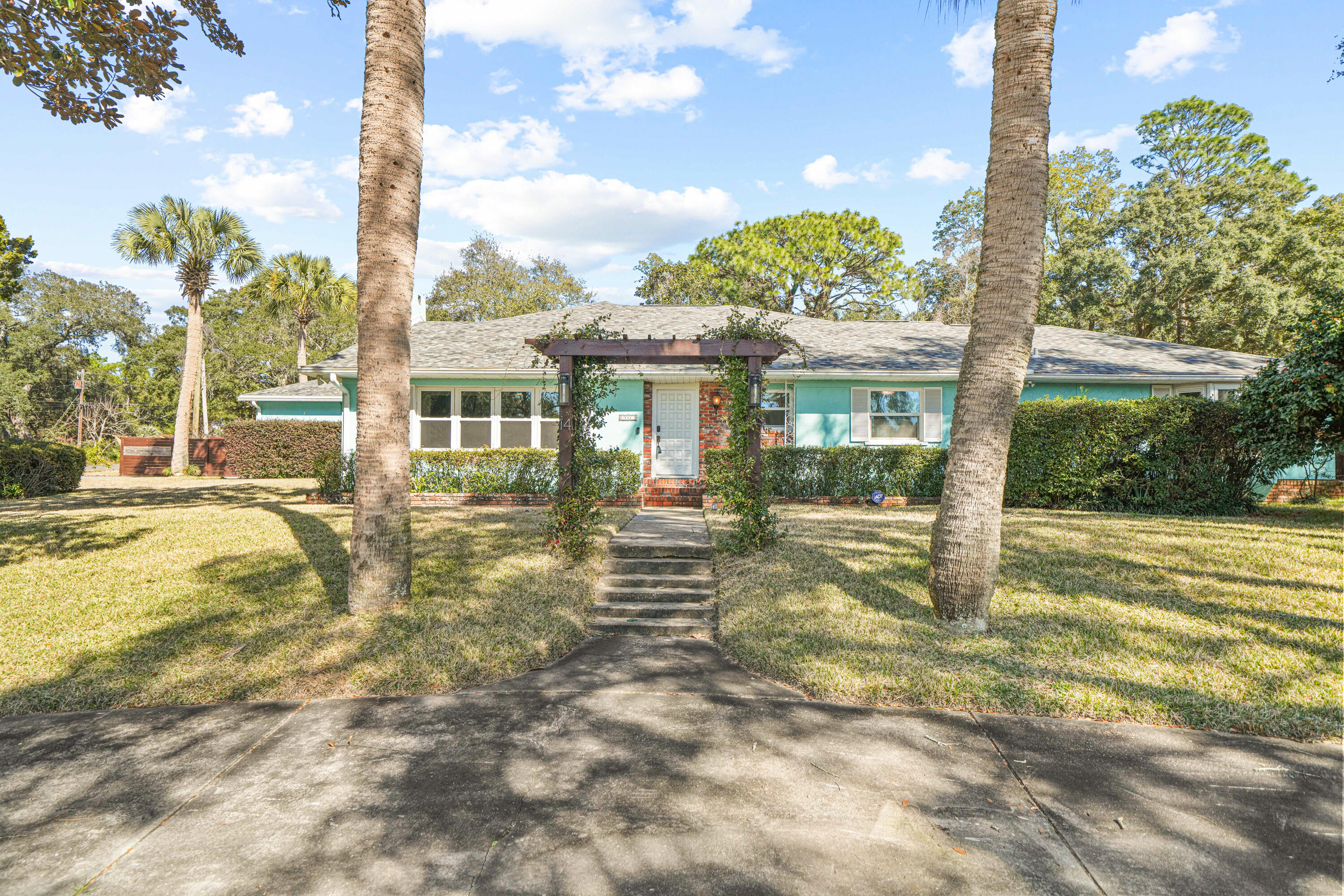 Welcome to an exceptional coastal retreat in the heart of Poquito Bayou, within close proximity to Eglin AFB, perfectly positioned on a .42-acre corner lot directly across from the water with captivating Bayou views and just minutes from the Poquito boat launch and neighborhood park. This impressive home offers over 3,146 square feet of beautifully designed living space—now elevated even further with the addition of a private pool, creating the ultimate indoor-outdoor lifestyle.  Designed for flexibility and comfort, this 5-bedroom home, featuring two spacious primary suites, is ideal for multi-generational living, a mother-in-law suite, or hosting guests with ease. The massive open-concept kitchen and dining area anchors the home, while modern updates, hardwood floors, a living room fireplace, and abundant natural light create an inviting coastal aesthetic throughout.  
The primary suite wing is a true retreat, complete with a large walk-in closet and a dedicated laundry room with direct outdoor access to the covered patio and pool areaan especially thoughtful layout that seamlessly supports relaxed outdoor living. Two of the bedrooms offer direct access to the pool, enhancing the home's resort-style feel, while one of the bedrooms has a separate entrance.
Additional upgrades include a whole-house generator and hurricane-rated windows and roof, providing peace of mind and year-round protection.
An oversized garage, spacious laundry/mud/craft room, and ample storage enhance the home's exceptional functionality. Step outside to discover a backyard designed for both relaxation and play, featuring several patios, a sparkling pool, a designated firepit area, an outdoor storage shed, and a generously sized yard with thoughtfully sectioned spaces for gardening, pets, and children. The property also showcases established fruit treesincluding peach, apple, cherry, lime, banana, olive, and grape vinesadding charm, shade, and a touch of homestead-style enjoyment.
With parking that's truly unmatched, the property boasts a five-car circular driveway plus an additional four-car driveway leading to an oversized two-car garageperfect for boats, RVs, and multiple vehicles.
This is a rare opportunity to own a water-view home with boat access, a pool, dual primary suites, premium upgrades, expansive outdoor space, and exceptional parking in one of the area's most sought-after neighborhoods. Coastal living at its finest.