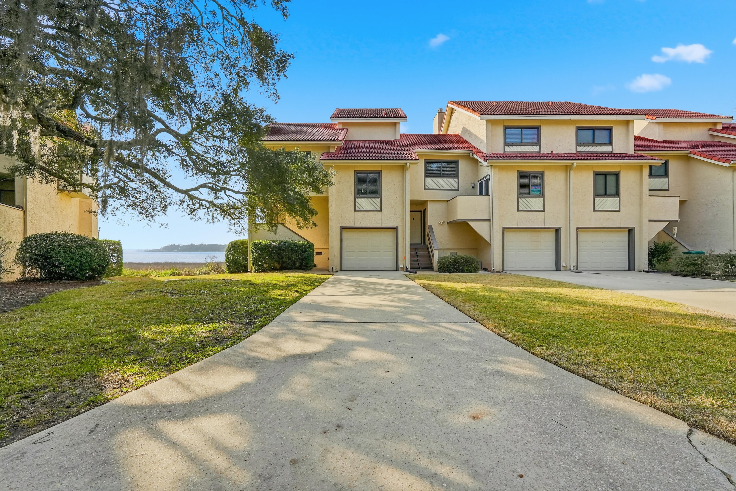 Stunning waterfront townhome in the heart of Bluewater Bay, offering breathtaking views of the Choctahatchee Bay and an effortless coastal lifestyle. This beautifully renovated three-bedroom, three-and-a-half-bath residence features modern finishes throughout and outdoor living spaces perfectly positioned to take in the water views.
Step inside to a fresh, bright, and airy interior highlighted by luxury vinyl plank flooring, updated lighting, and a cozy wood-burning fireplace anchoring the main living space. The open kitchen is designed to impress with stone countertops, designer backsplash, crisp white cabinetry, stainless steel appliances, and a dedicated dining area. A comfortable sitting room just off the kitchen and living area creates additional space to relax or entertain while enjoying the scenery. Upstairs, carpeted stairs and bedrooms lead to a second-floor loft on the landing with vaulted ceilings, offering flexible space for a home office or reading nook. The primary suite is a true retreat with vaulted ceilings, stunning bay views, sleek countertop in en suite, a large vanity, bath-shower combo, and a walk-in closet. An additional bedroom is thoughtfully designed, including a third full bath with a convenient walk-in shower and upgraded carpet. Additional highlights include a single-car garage, abundant storage, washer and dryer included, and a long driveway for extra parking. The HOA provides lawn care and pest control, allowing for low-maintenance living. Ideally located within walking distance to the marina, this waterfront townhome offers the perfect blend of comfort, style, and coastal convenience!
