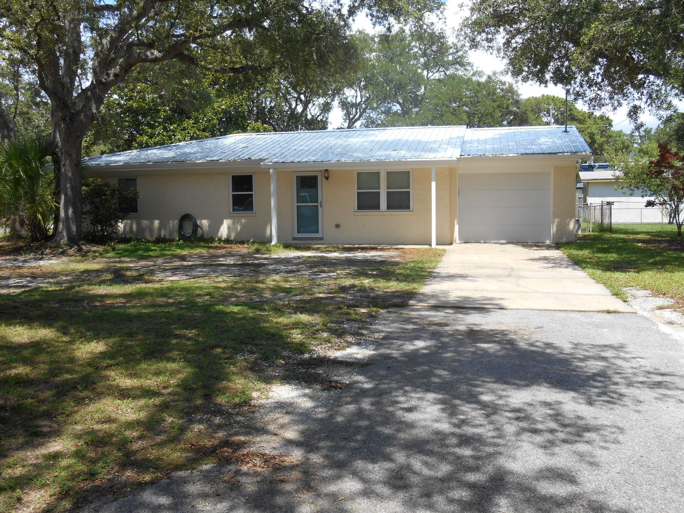 Renovated well maintained cement block home on a corner lot conveniently located in Shalimar, close to Eglin, Hurlburt, and the Beach.  Home was completely rewired in 2018, new metal roof in 2021, screened patio, Mini split A/C for the garage, A/C air handler new May 2025, new windows throughout with transferrable warranty in 2022, tile shower in Master Bath, new doors, interior trim, exterior trim and gutters. newer water heater, Kitchen features Stainless Steel appliances and granite/quartz (?) countertops.


Multiple offers received,  Highest and best by noon on 6/26.