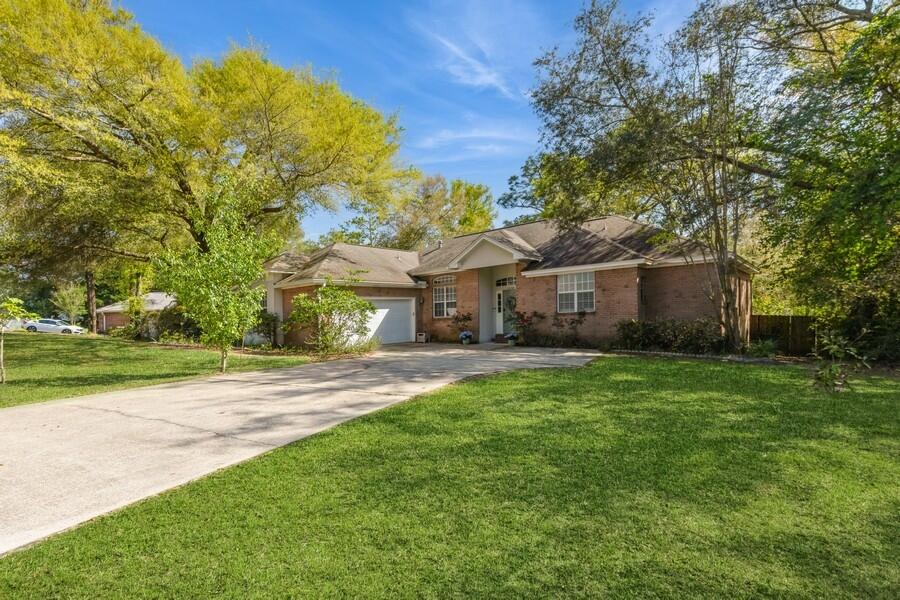 Enjoy Niceville living with the perfect combination of nature & luxury!! Welcome to this beautifully updated residence in Huntington, which sits on a spacious half-acre lot and offers gorgeous elevated views, while showcasing upgraded finishes throughout. Step inside to discover an open-concept layout, complemented by wood flooring and new carpet in the generously sized bedrooms. The thoughtful design creates a seamless flow from the living, kitchen, dining and flex room, perfect for both everyday living, work from home and entertaining. You'll adore the large, private backyard that backs up to a peaceful wooded area, providing a serene retreat right at home. Take advantage of the boat/RV parking behind a 9-foot gated privacy fence with a dedicated gravel drive. Don't miss the opportunity to call this property home!! Contact us today for your private showing!!