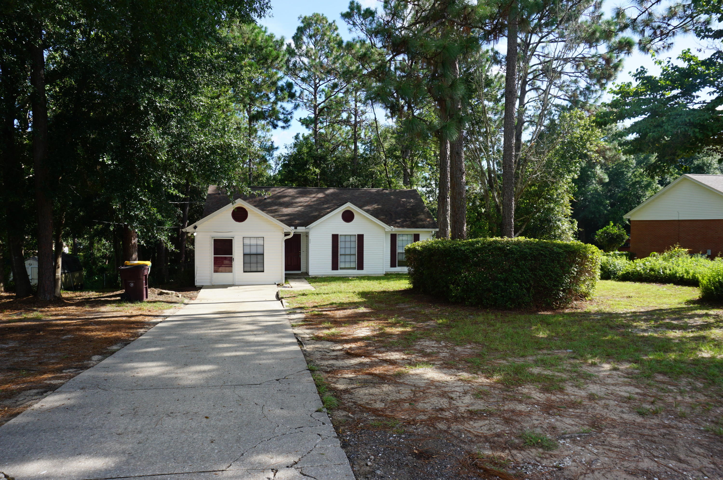 Available 08/17/2018...Just waiting on the new carpet..4/2 home on 1/2 acre in South Crestview. No HOA, wooded privacy, ceramic tile in main living areas and wet areas. New carpet and newer paint, newer fixtures, galley kitchen, & converted garage for additional bedroom area. Dining room area and granite. Covered front porch, over-sized driveway and plenty of room. Open back deck for outdoor entertaining and HUGE back yard. Fenced and YARD CARE INCLUDED in rental rate. 12 minutes to Special Forces Compound, 20 minutes to Eglin AFB, and easy commute to beaches and shopping. No inside smoking. Pets will be allowed with a $400 non-refundable pet fee.