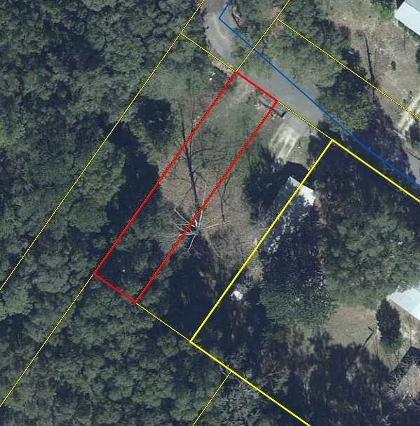 Lot inside the city limits that is just perfect for a tiny home!! Site built homes only allowed by city. This lot has a water tap that is already paid for. Come take a look and build a home or rental property today! There is a shed on property and OWNER FINANCING AVAILABLE.