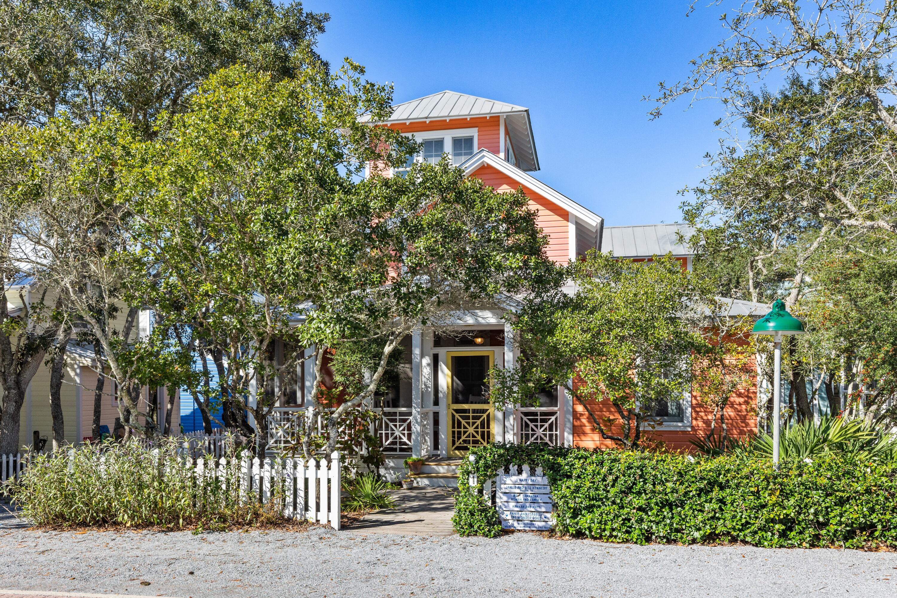 Oh Happy Day is a traditional Florida beach cottage that will bring back favorite memories of your family's summer vacations. Located six lots in from 30A, just a few minutes stroll to the beach, shops, and restaurants in town center. Relax on the front screened porch shaded by lush landscape. The living area is filled with light and sense of grand spaciousness provided by cathedral ceiling. Natural finished pine floors are found throughout the cottage. The galley kitchen with breakfast bar is open to the dining area. A side entrance leads to a mudroom, laundry room with storage and direct access to the kitchen. Two guest bedrooms, each with full baths are also on the first level. French doors off the dining room open to a private screened porch. Picnic in the backyard under the shady grove of oak trees.  Overlooking the living room is a sitting nook with an abundance of shelves to fill with your favorite books and collection of seashells.  The primary bedroom and bath are secluded at the rear of the second level with private balcony. On the 3rd level above the master suite is an enclosed tower with sofa. Views of Seaside's roof tops from the balcony off the tower are an amazing site to see! The house is built for comfort and year round enjoyment. Room to add guest cottage.