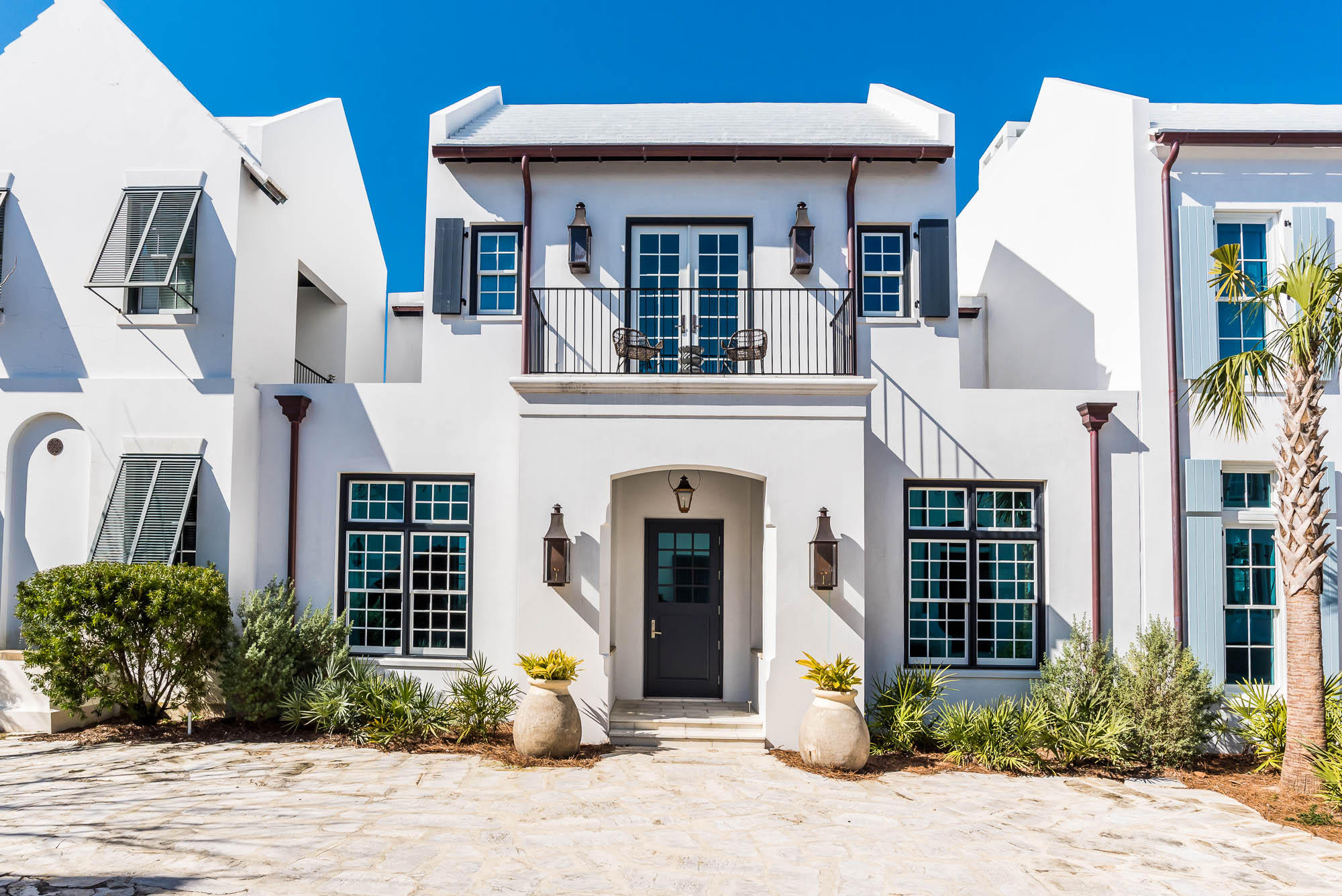 Vision and execution came together at 21 Lady Bug Court to create a 5 bedroom Alys Beach home that is set apart. Architectural design by William T. Baker gracefully defines the 4,596 square feet.
A first-floor Master Bedroom looks out to a private courtyard oasis that is anchored by a Gunite pool spanning 38 feet. Natural light fills the 800 square foot great room which contrasts its venetian plastered walls with a dramatic wood ceiling. The gourmet kitchen includes a 48-inch Wolf Range, dual Sub-Zeros, dual Asko dishwashers, an ice maker, a custom venetian plastered hood and Walker Zanger porcelain slab countertops.
A second-floor living area is set amongst 3 guest bedrooms and a second Master Bedroom that overlooks the iconic Sea Garden Pathway. A third-floor rooftop terrace hosts a