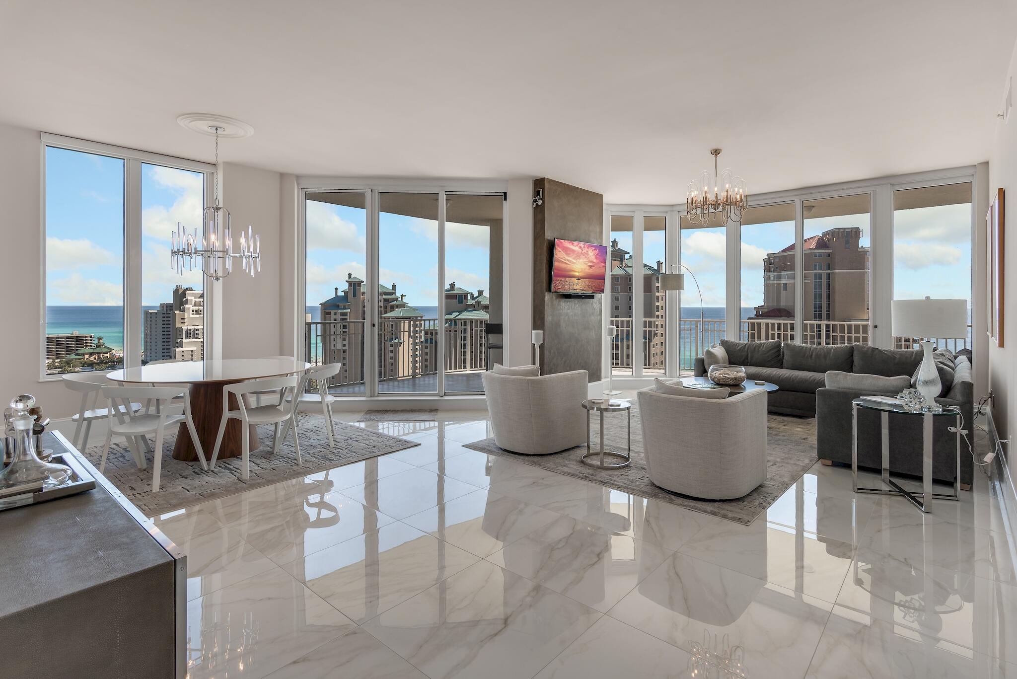 If you've been searching for a condo with exceptional gulf views, one that exudes coastal modern design; then search no more. This 18th floor end unit was thoughtfully renovated with a relentless attention to detail. No expense was spared in its renovation, from the building materials that were chosen, to the finishes and selections that were made to create its sleek modern décor. This condo is the embodiment of elegance and design. And did I mention the views? From its south balcony you can view the Gulf of Mexico, numerous lakes, golf course, and unobstructed views of the coastline looking east to 30A and west to Destin's East Pass, from the north balcony you will enjoy views of Choctawhatchee Bay, Baytowne Marina and the entire Sandestin Resort. The three bedroom.... three and a half bath condo is located in the gated building of One Beach Club inside the gated resort of Sandestin and is just steps to the beach. As the owner of this property, you will enjoy membership in One Beach Club and its private beach experience along with the privileges that ownership in the Sandestin Resort affords. Whether your interests are in golf, tennis, beaches, boating, fishing, shopping or dining; you'll find it all in Sandestin.

Upon entering the residence your eyes are immediately drawn to the 30"x30" porcelain tiles that flow throughout the entire living space of the condo. They serve as the foundation for the coastal modern décor as they blend seamlessly from one space to the other. Just beyond the entry foyer, there are two guest suites that open out onto the north balcony; each with their own ensuite. Beyond the entry foyer, the space opens to the living area and the views, well they simply take your breath away. The living room, kitchen and dining area are open to one another and boast 270 degree views of the water, coastline and the Sandestin Resort. The open space is magnified with the 10' tall ceilings and floor to ceiling windows and doors. The kitchen features modern custom cabinets that are distinctive and unique. The quartz counters waterfall to the porcelain tile and frame the custom cabinetry. The dining area is juxtapose to the kitchen. Those that are fortunate enough to enjoy a meal at the table will enjoy its numerous views. The living area is centered with a Venetian Plastered column that anchors the room and serves as the easel for the large screen LED TV. The Owner's Suite is a private inviting space with a generous ensuite that includes a walk-in shower, large undermount soaking tub and his & her vanities. The bedroom's floor to ceiling glass frame the views of the Gulf of Mexico and provide the perfect respite from a day at the beach. The Owner's bedroom suite opens onto the south balcony as do the living and dining areas. The private and expansive main/south balcony wraps around the south and east elevation. It affords more than 200 degree views; taking full benefit of the water and resort views all while being secluded from your neighbors. For those discerning investors that seek the essence of design and coastal living, you've found your place at the beach.

One Beach Club is a private, gated, rental-restricted building. Owners enjoy use the of the exclusive Beach Club, media room with theater seating, workout center and oasis pool. For a nominal cleaning fee, Owners have use of the One Beach Club guest suites for out of town guests. 
  
Sandestin Golf & Beach Resort is a 2,400 acre golf cart friendly community that affords the ease and convenience of navigating the Resort with a golf cart and unit 1801 conveys with its very own deeded parking space for your own personal golf cart. Sandestin is a World Class Resort destination and has been named the #1 resort on Florida's Emerald Coast. The resort is comprised of over 70 unique neighborhoods and features miles of sandy white beaches, pristine bay front, four championship golf courses, a world-class tennis center, 4 resort swimming pools, plus 15 private neighborhood pools, a 113-slip marina, a fully equipped and professionally staffed fitness center and spa, meeting spaces and The Village of Baytowne Wharf, a charming pedestrian village with events, shopping, dining, family entertainment and nightlife. For true golf cart community living, Grand Boulevard is just outside the resort gates and provides access to additional shopping, dining and entertainment. Come to Play, Stay for Life!