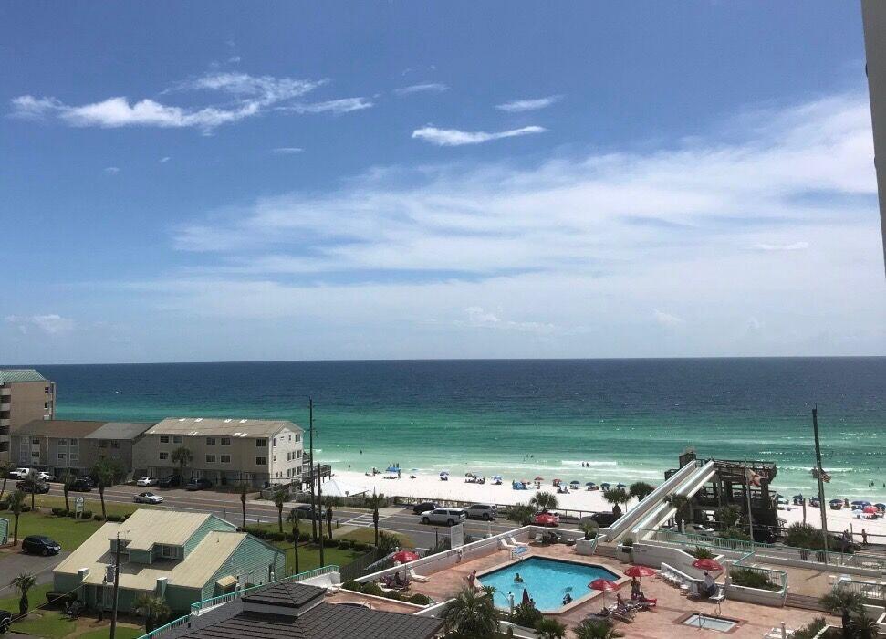 Step out onto the oversized balcony and take in stunning views of the Gulf from multiple angles—it's the perfect spot to relax and unwind. This fully renovated costal style unit is currently generating income as a two-bedroom, two-bath rental. It's being sold fully furnished, with existing bookings that will transfer to the new owner—making it a turnkey investment or vacation home.  Easy access to the beach via the sky bridge and located on the popular pedestrian/ bike path with many fun restaurants and attractions in the area.  You'll enjoy a wide range of resort-style amenities including a sparkling pool, two hot tubs, a fitness center, spa, pickleball and tennis. There is also beach chair service available, seasonal bonfires, and a beach bar for those laid-back days in the sun, as well as a great on-site restaurant. Everything you need for beachfront living at its best.