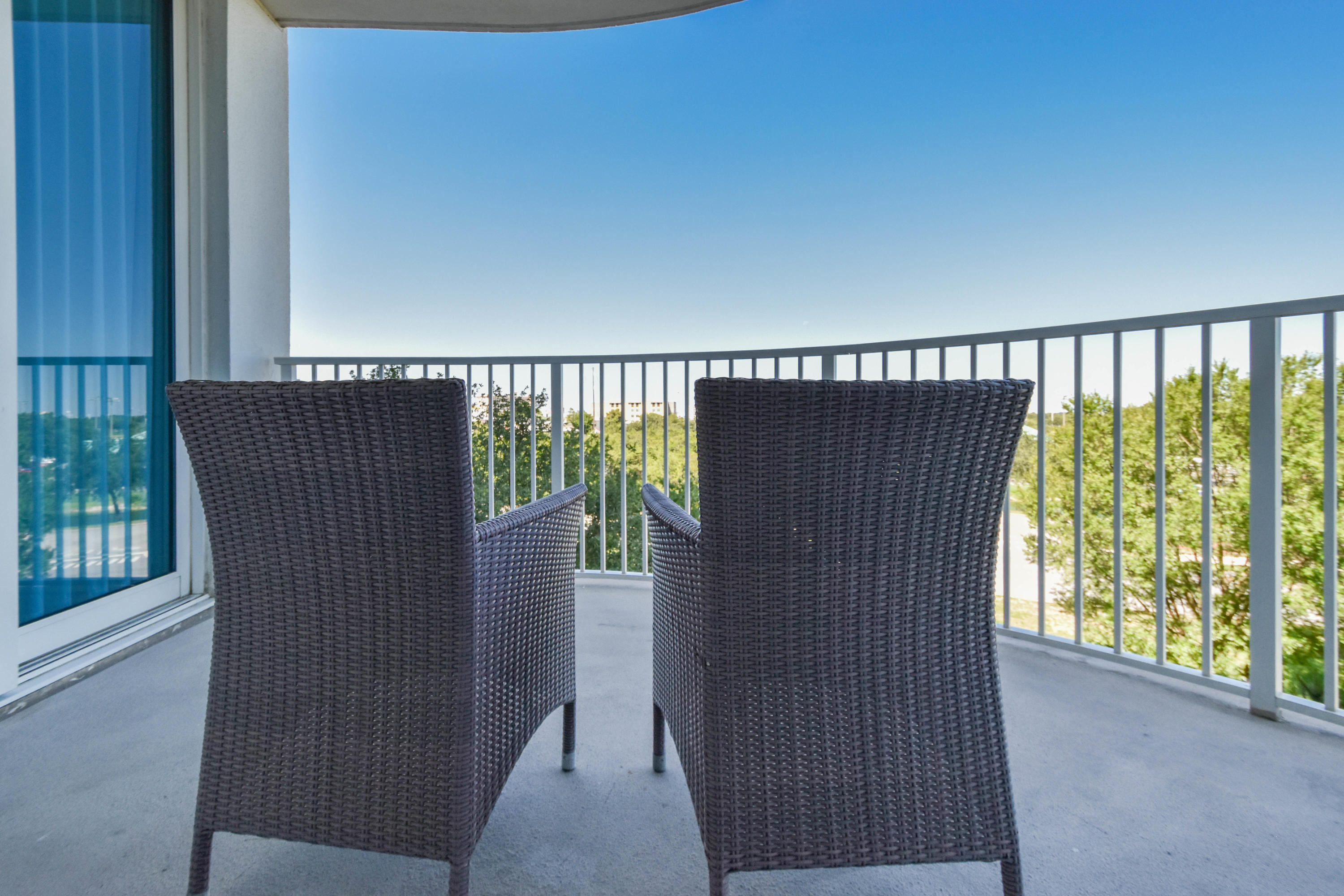 This westerly facing junior two-bedroom condo offers an open concept living and dining area, as well as an inviting large balcony. The lagoon pool and water features are the resort's crowning attractions. Onsite amenities include multiple pools with waterfall features, a hot tub, playground, fitness center, and tennis and basketball courts. Also, newly added, is an on-site restaurant offering lunch, dinner, room service and even in-season poolside service. Shuttle service to the June White Decker Public Beach access is offered in-season. All utilities are included in HOA dues  water, sewer, electric, cable, WiFi, phone, trash! Excellent opportunity for a vacation rental, second or primary home.