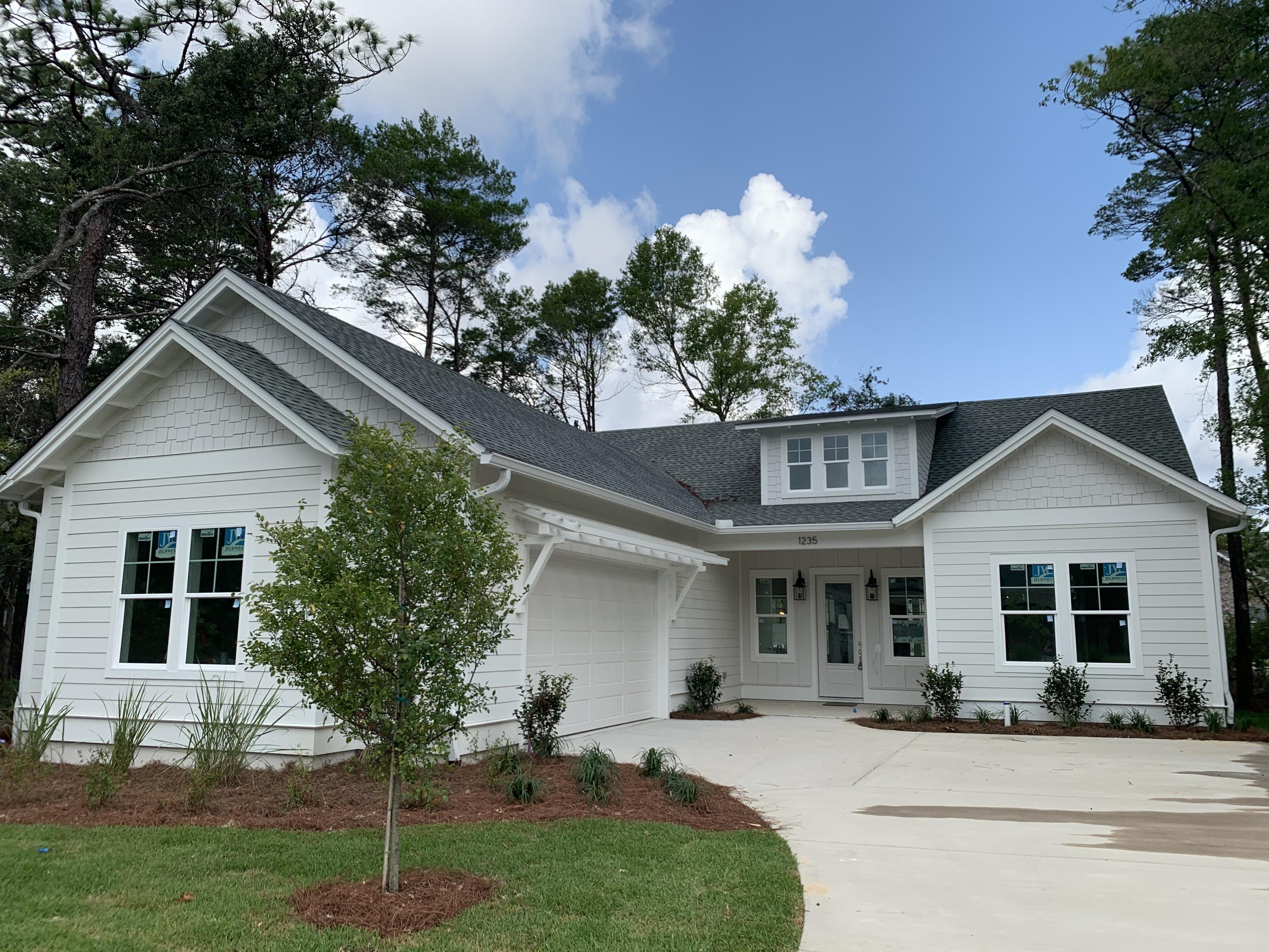 Deer Moss Creek new construction, completed July 2020, beautifully staged for the Parade of Homes. Construction features include 2x6 construction, R19 insulation, impact glass windows, spray foam insulation in attic, upgraded media wiring, architectural detail upgrades, and covered front and back porches. Interior features include LVP flooring, white shaker cabinetry, stainless appliances, nickel plumbing fixtures. The beautiful master bathroom has a separate shower with a free standing bathtub, double vanity sinks and more. Also, you'll love the Aprilaire Fresh Air HVAC System and dehumidifier. Deer Moss Creek is a mixed-use community with plans to include single family, multi-family, commercial, a town center and an office park. Don't miss your chance to get in on Phase One.