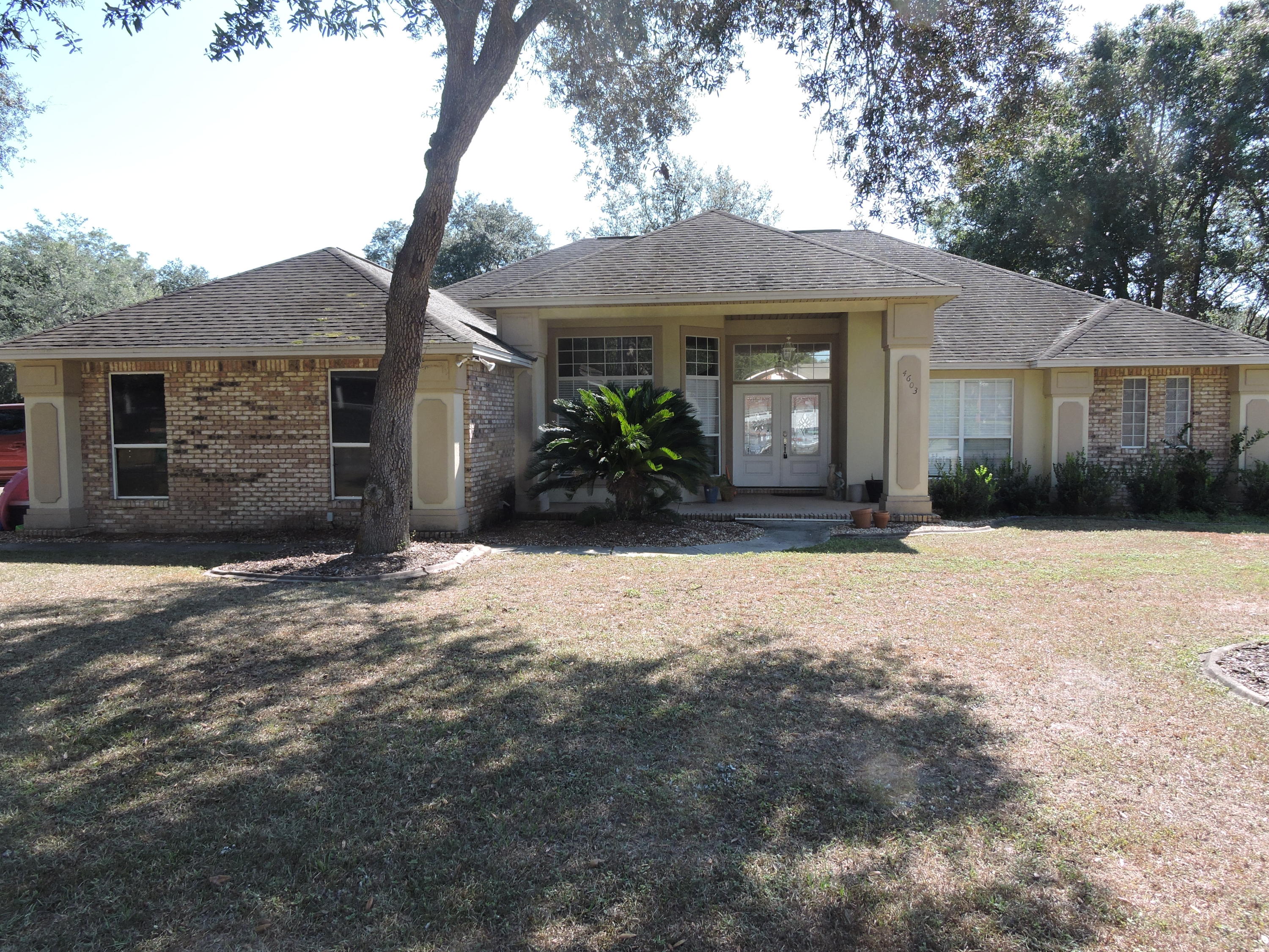 Available 10/25 - South of I-10 conveniently located just off of Live Oak Church Rd on a peaceful culdesac lot. This beautiful brick and stucco home features open concept kitchen/living dining room with a gas fireplace accenting the area. The master suite checks all the boxes with sitting area, large walk in closets, jetted tub with separate walk in shower. The kitchen features stainless steel appliances and granite counter tops. The additional bedrooms are nice sized with ample closet space. The home also has and office/flex room that could be used as a 4th bedroom off if living room. The home also have a florida room and patio area perfect for entertaining. the backyard is fenced and level with a cover for a camper or a boat. Schedule your showing today!