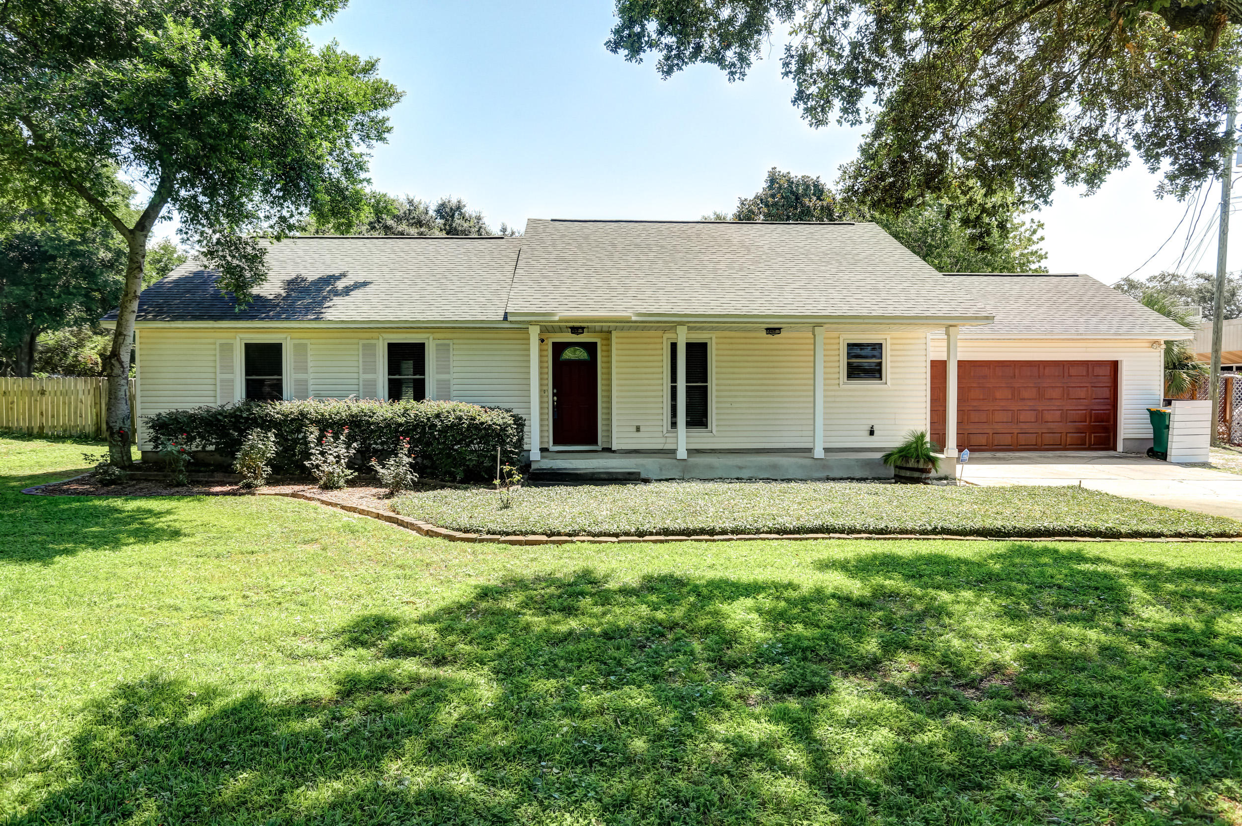 Move in ready three bedroom two bath home located on almost a half acre.  This home is light and bright featuring an open floor plan with and soothing neutral colors.  The open kitchen offers stainless steel appliances, granite tops and a large breakfast bar.  The living areas are graced with wood floors, a wood burning fireplace and and built-ins.  Both bathrooms have been updated with new vanities and new fixtures. The enhancing back yard has a large deck, perfect for entertaining. Also the rear yard is fully fenced and beautifully landscaped.  The back yard  is large enough for RV storage or a detached garage.  Enjoy the many recent improvements this home has received.  Roof 2013, Impact Windows 2015, Water heater 2013.  Call today and schedule a showing!