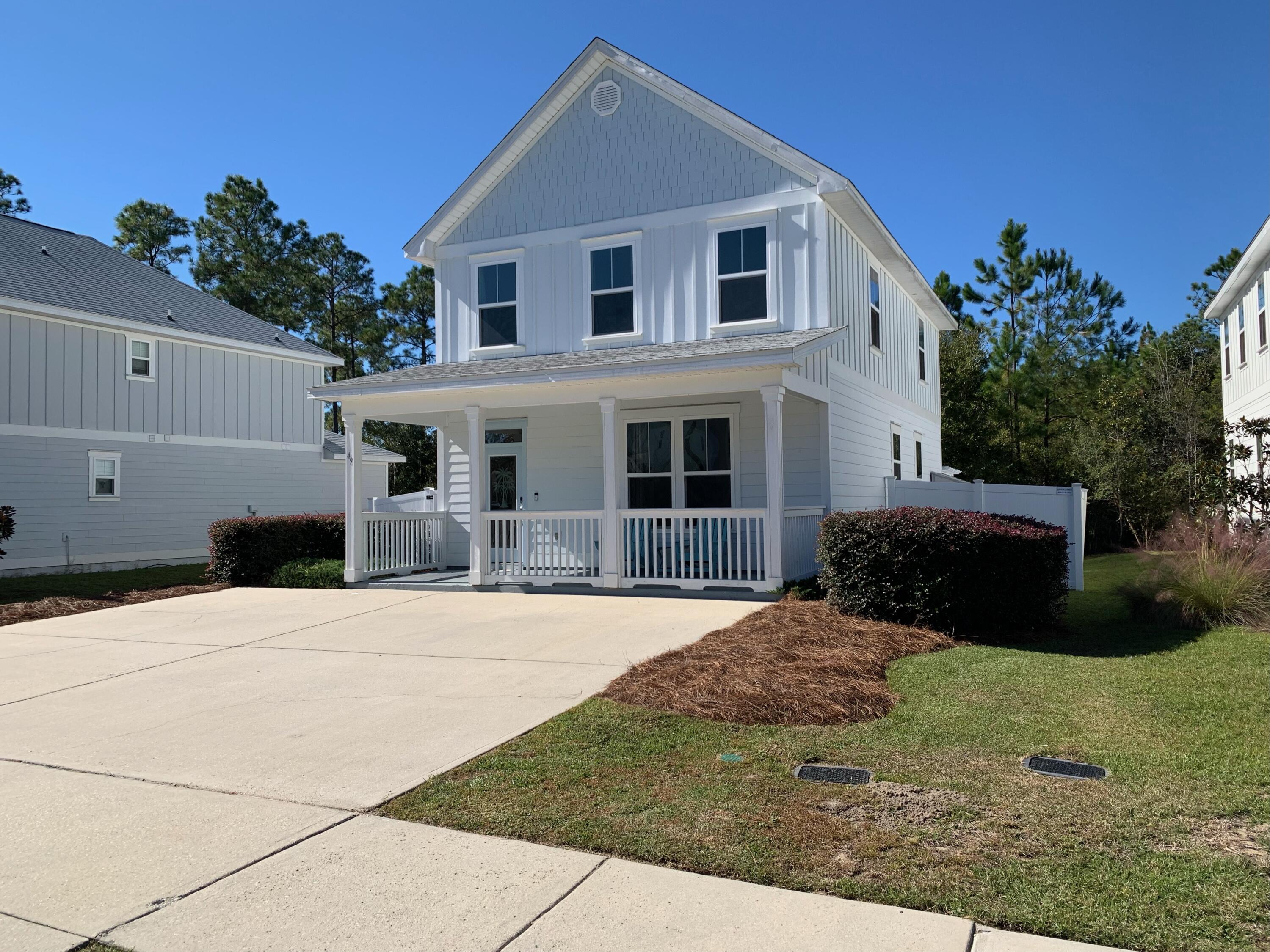 Welcome to the popular community of Audubon Point that is nestled between  the Point Washington Forest.  Down the street from Eden Gardens State Park and Public boat ramp to lauch your boat, jet ski, kayak or paddle board onto Tucker Bayou.  Enjoy the quietness of Point Washington yet you are only 3 miles from the beaches of 30A.   This 4 Bedroom 2.5 bath home is perfectly located on a quiet cal de sac.  Inside you will find 9 foot ceilings and tall windows in the open concept main floor.  Kitchen has a large island, granite counters and glass backsplash.  Main level has gray wood look tile throughout and all updated lighting.  Bonus room on the first level can be used as an office, guest bedroom or playroom. Privacy fenced yard with concrete pad and pergola is perfect for entertaining or just relaxing and enjoying the peacefulness that backs up to conservation woods. Side porch is covered and has a storage room that can be used as a workshop. The second floor master bedroom has vaulted ceilings and plenty of room for a sitting area. Master bathroom has large glass enclosed shower and walk in closet. Additional bedrooms and laundry are also on the second floor.