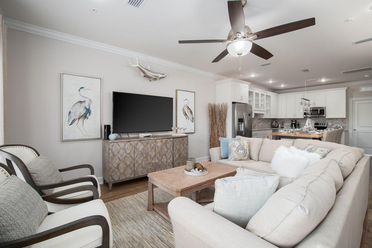 Great investment property opportunity in Miramar Beach!  This energy efficient townhome, built in 2017, will not disappoint. Easy walk to the popular Pompano Joe's Restaurant offering public beach access and parking. This upscale, three story, one car garage, townhome has four bedrooms and four baths. The first floor has a spacious bedroom with two built-in bunk beds, a full bath & a full size stackable washer and dryer. The main living area is on the second floor with an open living room, dining area/kitchen, bedroom & a second full bath. On the third floor you will find the master bedroom with the ultimate ensuite bath; a gorgeous oversized shower & soaking tub as well as another bedroom with a private bath and a second full size washer and dryer. Professionally furnished and decorated, this home features beautiful oak hardwood floors throughout, crown molding, porcelain tile, and stainless Frigidaire appliances. On the private patio, relax and grill after a day at the beach. The community is beautifully landscaped with paver driveways and a community pool with bathrooms. There are only 20 units in this private complex which is ideally located very close to local attractions, restaurants, grocery stores, shopping, entertainment and much more. Gross annual rental income potential for this townhome is $50,000+.