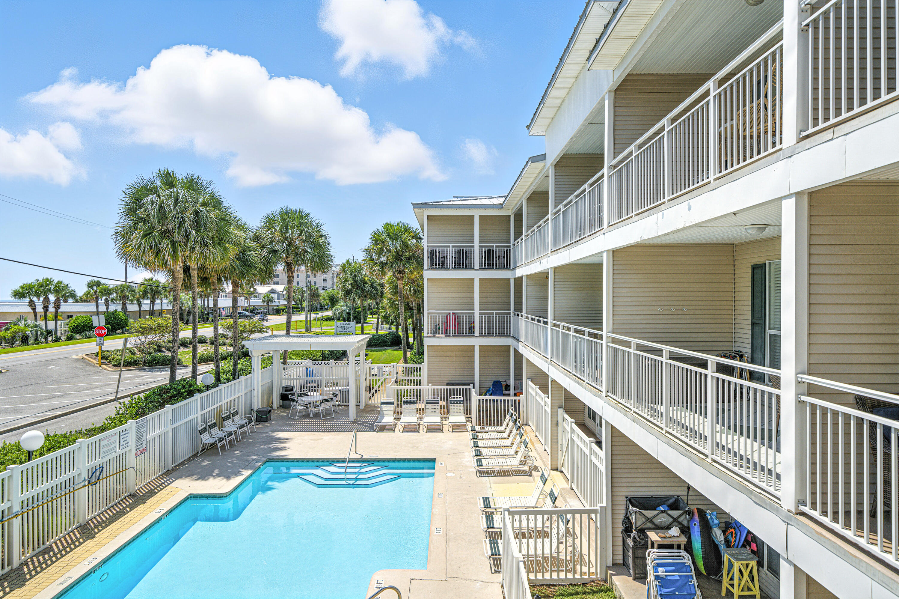 ***LOWEST PRICED CONDO IN THE BUILDING*** This perfectly located condo has 1 bed / 1 bath + hall bunks and is on the 2nd floor of this 3 story walk-up building across the street from a Public Beach Access to the Gulf of Mexico.  This unit has an exceptionally large lanai shaped like an 'L' offering great views. Full size washer/dryer in unit.  Sold completely furnished, including electronics, its ready to rent!!  HOA fees cover everything except electricity and contents insurance condo.  Contents insurance is approx. $2000 a year.  There is plenty of parking, a large pool, hot tub, a grassy area for your pets and a BBQ grill and picnic table.  The complex has passed its Milestone inspection, SIRS and has no foreseeable assessments.  Look at 'Documents' tab for governing documents.
