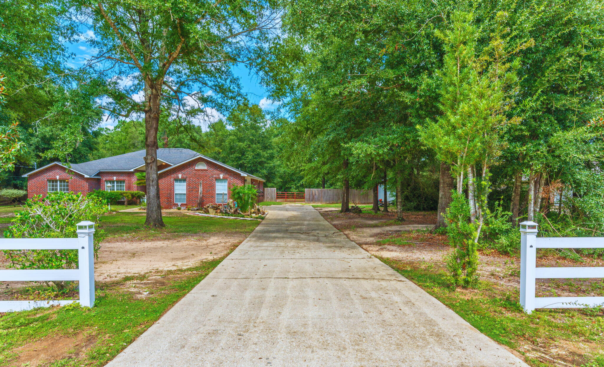 Welcome to Countrywood Estates! This beautifully updated 4-bed, 3-bath home offers 2,609 sq ft of comfort and style. The kitchen was fully renovated in Feb. 2025 w/ a custom butcher-block counters, tile backsplash, open shelving, upgraded cabinetry lighting, and stainless steel appliances (2018). A striking wood-tile foyer flows into the dining, living, and sitting areas, highlighted by a shiplap accent wall, modern fixtures, and a covered patio. Recent upgrades include a 2024 HVAC. The front yard features a charming fishpond (fish not included), while the spacious 1-acre lot includes a workshop & plenty of room to add a custom pool . NO HOA—bring your chickens! A new roof will be installed prior to closing w/ an acceptable offer. Call today to tour this great home!