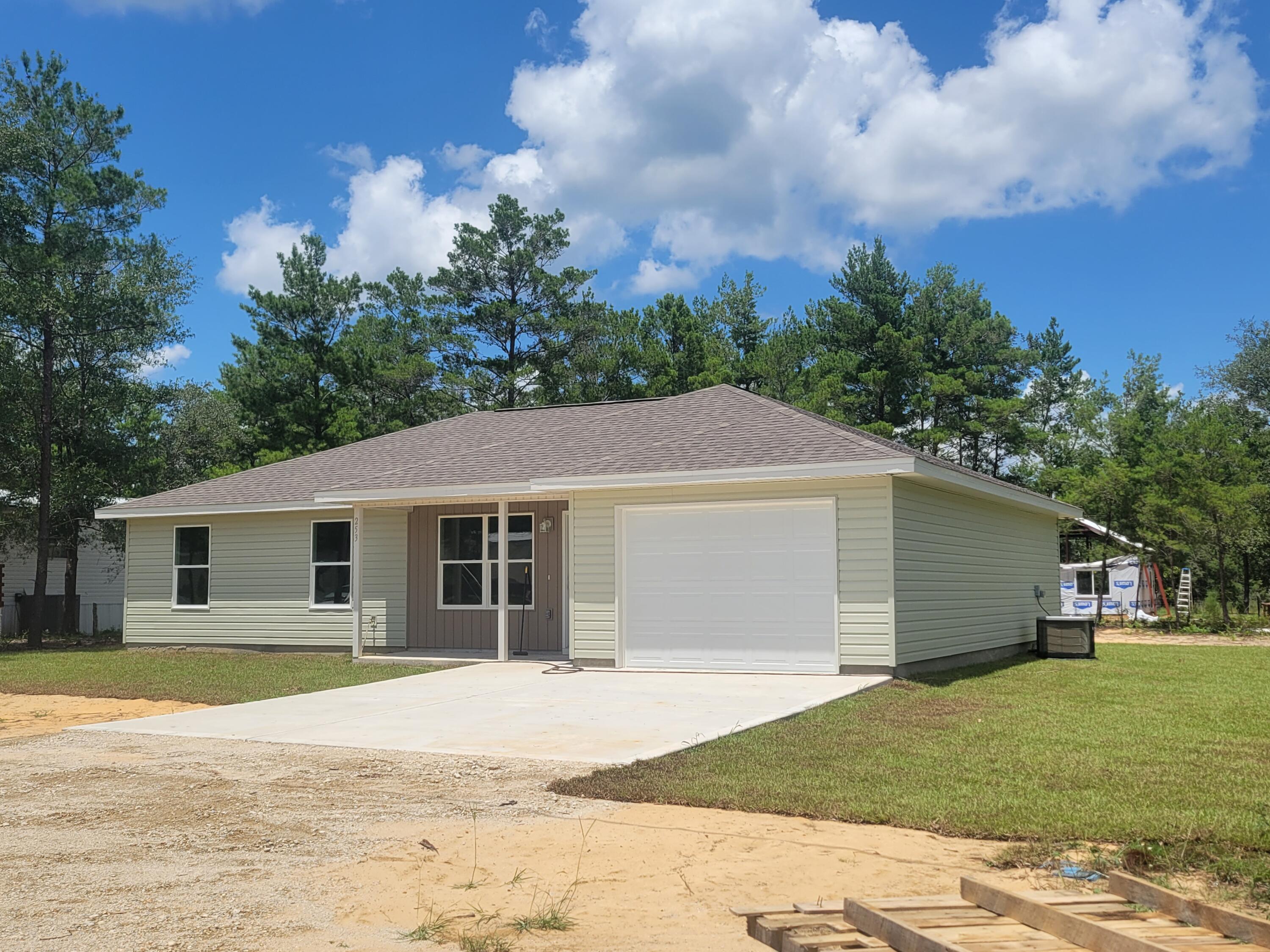 Check out this Brand New just completed home that is  waiting for you!  It has a heated living space is 1275  s.f., central air/heat, shingle roof,  with 3 bedrooms, 2 bathrooms, stove and dishwasher and Two car finished garage (could be converted at a later date to more living area possibly). Home will easily qualify for FHA, Conventional OR 100% financing through the Rural Development Program or VA.  Click on 'Document Tab' for House  Floor Plan.   Seller to pay up to $7,500 of the closing costs.