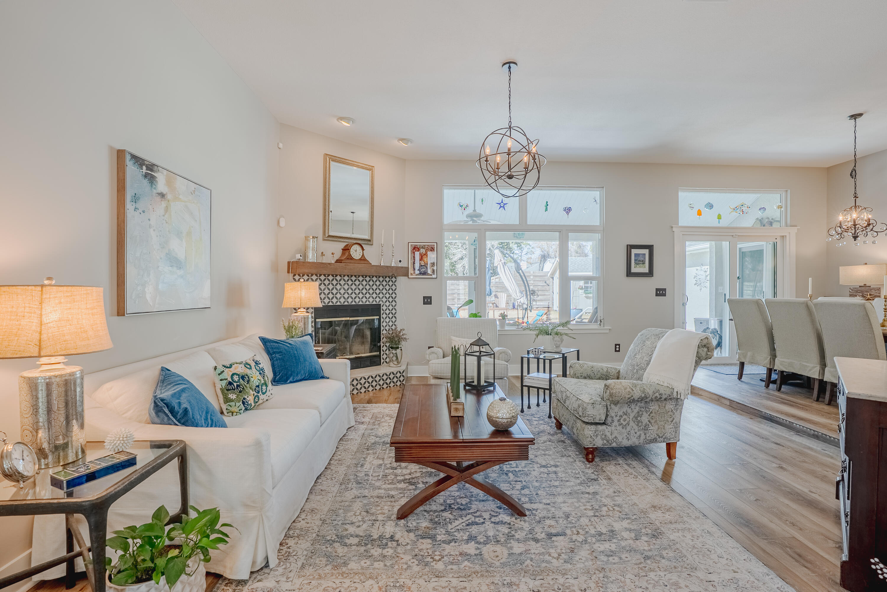 Step into a home that feels straight out of a coastal living magazine. This stunning 4-bedroom, 3-bath residence is one you'll be truly proud to call home, offering the look and feel of new construction thanks to extensive post-Hurricane Michael renovations--including a new roof, doors, windows, and flooring. The kitchen was also beautifully renovated so the entire home shows like new. From the moment you enter, the details impress. High ceilings, beautiful wide-plank flooring, coastal-inspired trim, plantation shutters, designer lighting, and a gorgeous chef's kitchen set the tone for effortless coastal elegance. The thoughtfully designed layout places the kitchen, dining, and living spaces at the heart of the home--perfect for both everyday living and entertaining. The right wing of the home offers exceptional flexibility with private guest quarters and a spacious den that opens directly to the pool, making it ideal for a mother-in-law suite or extended stays. Outside, the large backyard and inviting swimming pool create a true resort-style retreat where every day feels like a vacation. A separate workshop/storage building provides space for gardening, projects, and storing pool and beach gear. Tucked toward the end of a quiet cul-de-sac, this home offers added privacy with minimal traffic--creating a peaceful setting that feels like a private retreat while still being close to everything Panama City Beach has to offer. With no HOA, you have the freedom to bring your boat, RV, or other recreational toys--there's even room to open RV slide-outs when guests visit. Located just a golf cart ride from the beach, restaurants, and entertainment, this home offers the ultimate Panama City Beach lifestyle. Imagine cruising to dinner, enjoying nearby attractions, or heading out for an evening at Tootsie's when it opens. Short-term rentals are allowed, making this an excellent opportunity for personal enjoyment, hosting guests, or investment potential. This is coastal living at its finest--beautiful, flexible, and perfectly positioned to enjoy everything Panama City Beach has to offer.