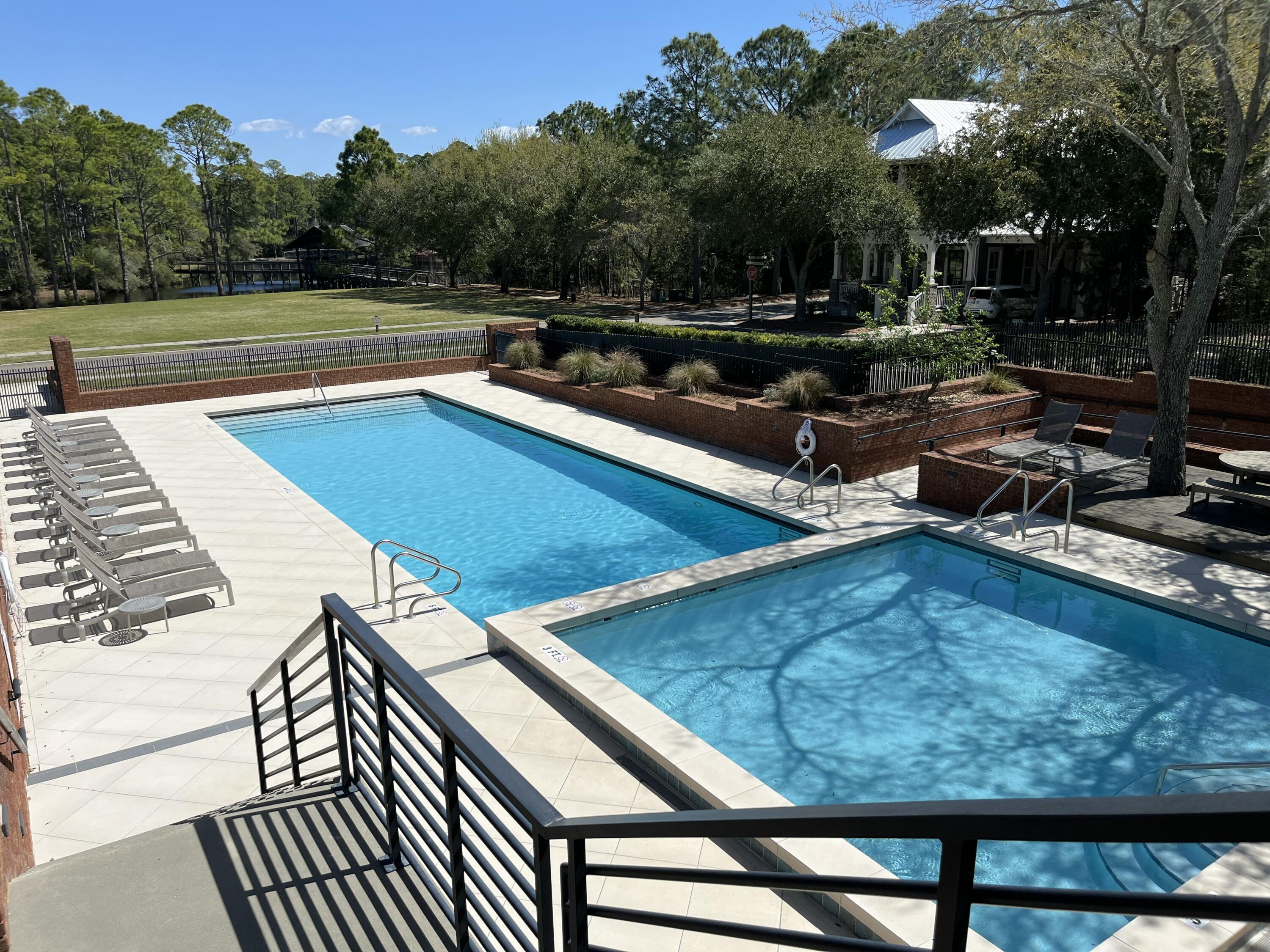 Rare corner lot homesite in sought after community of Forest Lakes right off Scenic Hwy 30A!  Build your Forever Home nestled in this quaint tree-lined gated neighborhood just a quick bike or golf cart ride to Emerald Green Waters and White Sugar Sands! This listing features HOA approved home plans for a 3,194 sq foot home designed by Margaretten Architectural. Detailed landscape plan and a prepaid parking space on the road also included. Owners and their guests can enjoy catch and release fishing in the lake, a gated pool, bbq area, and picnics on the tranquil greens!