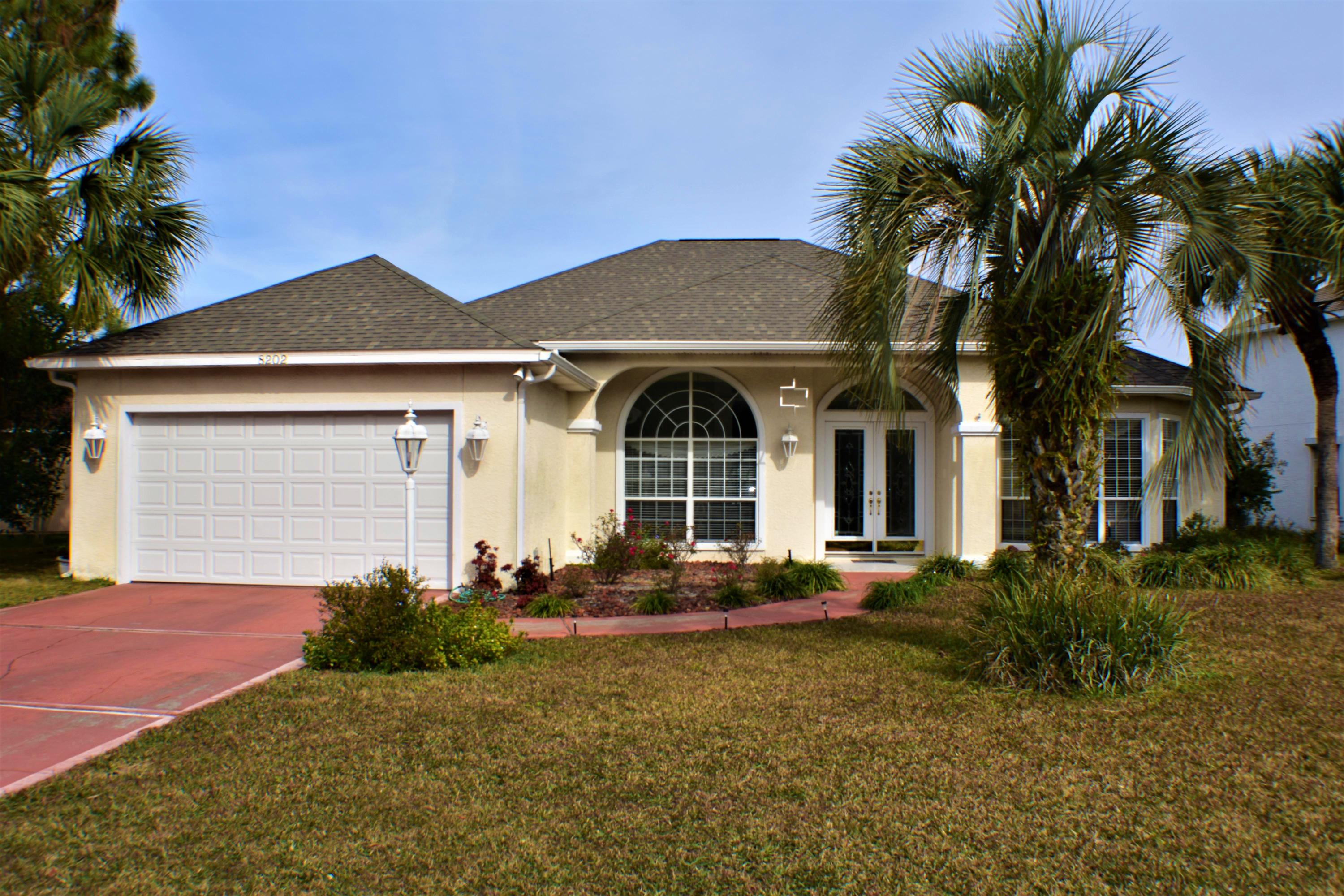 This Palm Bay pool home is a designer's dream! Featuring a split-bedroom floor plan, this is a very spacious 3BR/2BA home with lots of extras. Features include a 12 ft. foyer w/ leaded, beveled glass doors, hardwood pickled oak floors, two fireplaces (one in living room, the other in the master suite), formal dining room, office/parlor, built-ins, and an extra large two car garage. Recent improvements include a new screened enclosure for the pool, the roof was replaced in 2019, and there are two water heaters. The yard behind the in-ground pool is like a botanical garden offering a gorgeous view and plenty of privacy. Palm Bay is centrally located in the North Lagoon area, just minutes from the beach, marinas, restaurants, Navy base and more! All info approx. Buyer to verify.