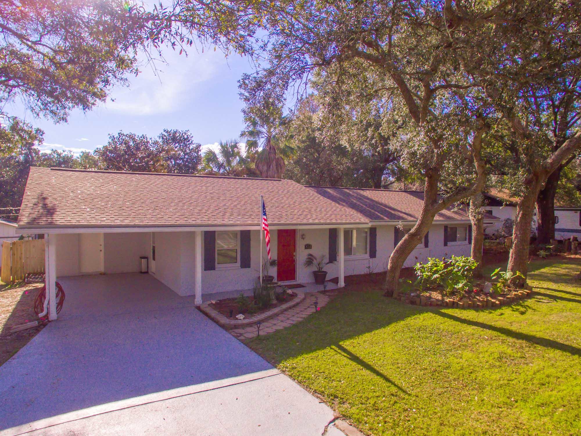 This is a must see. Solid block home built to last with a brand new face lift. The open floorplan uses every bit of its sqft to its absolute potential. Large bedrooms with a gorgeous master suite and bath. This home features Brand new GE appliances, new roof, new plank herringbone flooring in the living areas, new ceiling fans, LED lighting throughout, seamless gutters on front of house, irrigation system, 12V landscape lighting, fresh paint inside and out , ceiling fans, vanities, gorgeous marble countertops, toilets, LED lighting throughout. Like to entertain? grab a cocktail and relax by the large pool on the large deck with the mood lighting? Very peaceful and private. There is room to park a boat.  Double gates lead to a large workshop with plenty of room for the tools or a car, with plenty of built in workbenches., You can not find anything in Destin of this caliber at this price!!! Call today!!!