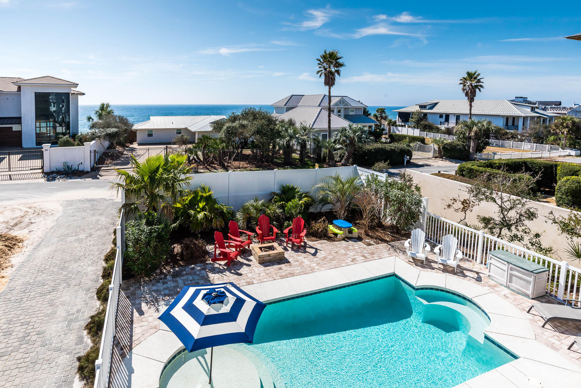 With convenient proximity to Watersound, Rosemary, and Alys Beach, plus the privacy of gated neighborhood access, Pelican Pointe at Camp Creek is ideally situated on the bustling east end of 30A. Poised second tier from the Gulf with expansive Gulf views, the residence is perfectly designed to be sure your guests will experience the ultimate beach vacation: the exterior features a large, private heated pool and fire pit, community beach access less than 250 steps away, and ample parking. Enjoy a view of the Gulf from four of the spacious bedroom suites. With all these amenities, it's no wonder that the home has an established annual rental income history of $194,000, trending upwards to a projected gross of $270,000 from local rental management companies. When it's time for a break from the sun, use one of the home's two large entertainment rooms to watch a movie, play a game of pool, foosball, or ping pong, or just hang out on one of the home's three large shaded porches and balconies. You'll be wowed by the home's thoughtful design: it sleeps 30 people, while still offering the privacy of five bedrooms with en-suite bathrooms, plus two bunk rooms outfitted with four queen beds each.  The second-floor kitchen, which offers beautiful views of the Gulf across the street, boasts ample cabinet space, a 36-inch gas range, a large island plus a large dining table, two refrigerators, and two dishwashers, ensuring your guests have plenty of space to stay out of the chef's way.  Lovely wood floors, granite kitchen counters and bathroom vanities, and tile shower enclosures offer style and durability.  This home is offered fully furnished inside and out, making it a turn-key property that's ready to generate fantastic rental revenue or the perfect place for a private family retreat.