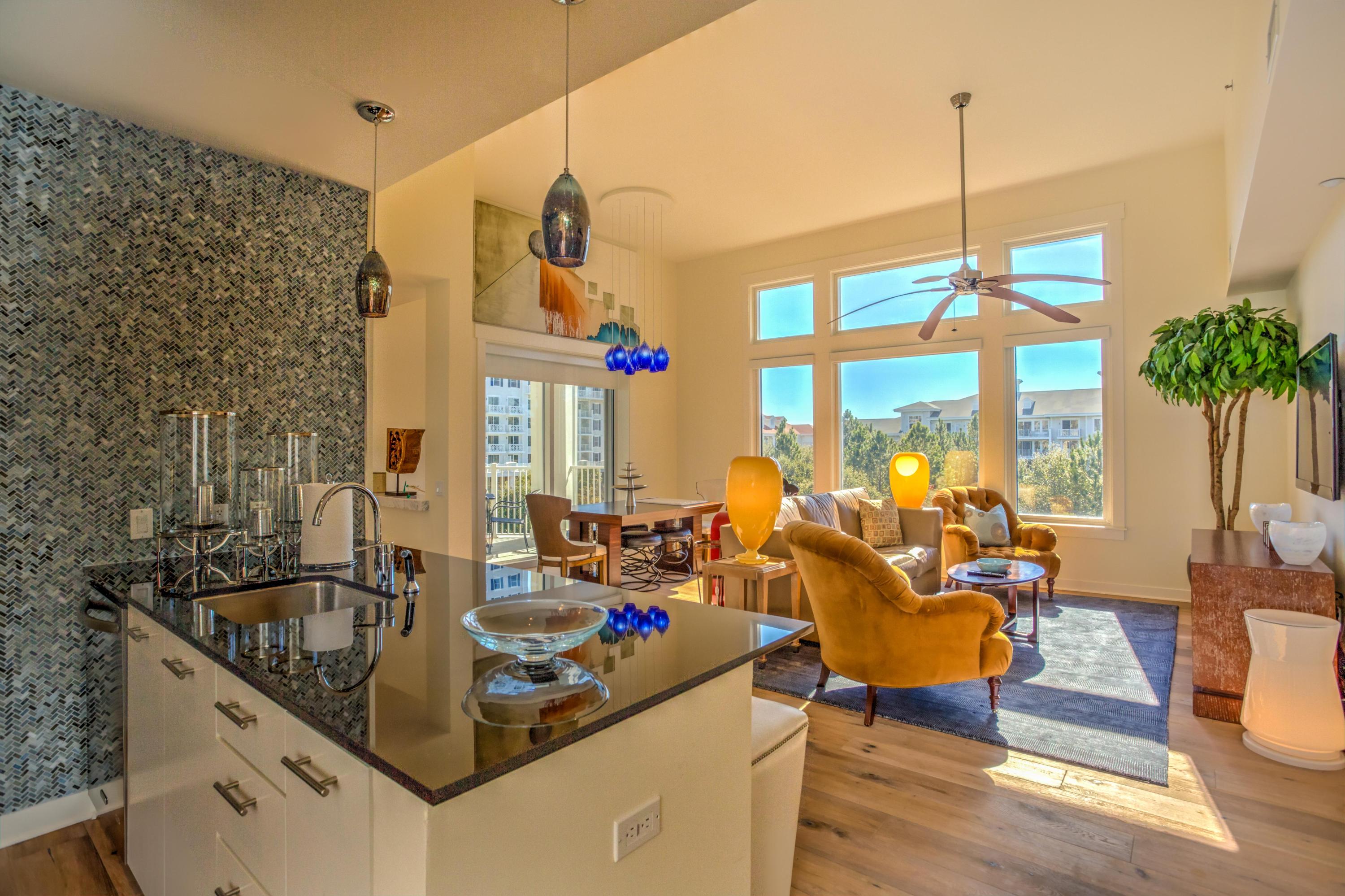 This gorgeous corner condo with bay views has been fully upgraded. Hardwood floors flow throughout the condo with beautifully crafted marble bathroom counters and floor. The tile work in the kitchen brings the unique colors of the Emerald Coast into this one of a kind unit. The Bahia Complex is only steps away from Baytowne Wharf, tennis, golf, and just a short bus ride to the beach. Amenities of Bahia include: multiple hot tubs, pool, access to private Solstice Club, exercise room, and indoor parking. Sold as unfurnished; also chandelier is excluded, but will to negotiate on Furniture and chandelier. Buyer must verify all data and specifications.
