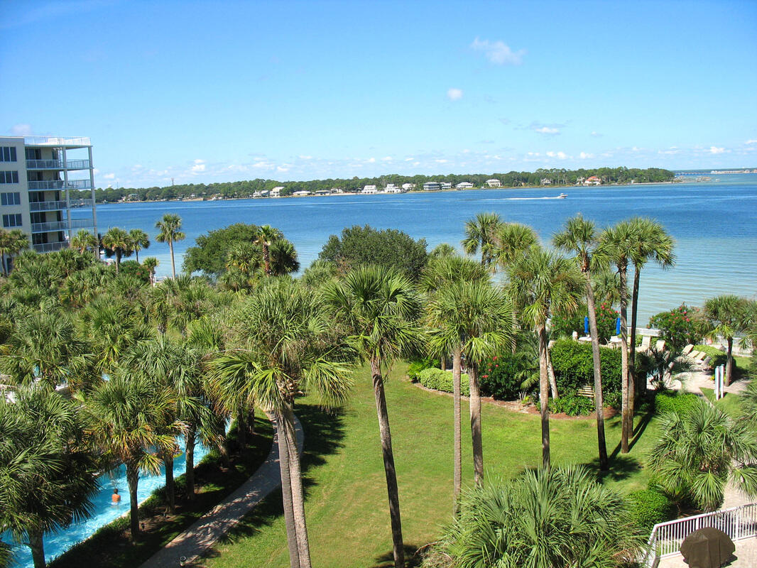 This lovely condo has it all. Fantastic view of the bay and a great view of the Gulf of Mexico as well, thanks to the extended wrap around balcony. Updated flooring, stainless steel appliances , and granite counters make this condo pop. Plenty of room for the whole family, sleeps 9, and you can also take advantage of the lucrative rental market.  Many great amenities including the famous lazy river pool. The sky bridge makes it easy to get to the beach.  There are boat slips on the bay side.  Located near  many fun attractions and restaurants.  Find out why Destin West is one of the most popular complexes on Okaloosa Island. Buyer to verify all information. Photos coming soon. Go to rental website to see pics http://www.destinwestvacation.com/osprey-506.html
