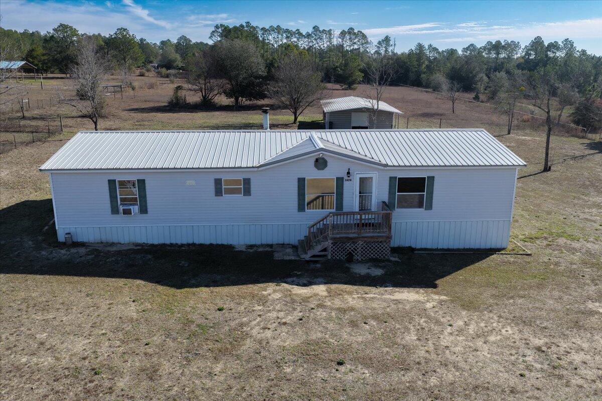If you've been dreaming of space to spread out and create a true homestead, this fully fenced property is ready to welcome you. Designed for rural living, the land is already set up for horses with a pole barn featuring pull-down storage doors, fans, floodlights, electric hookup, and a dedicated watering and grooming station. Additional fenced areas provide room for chickens, goats, or other livestock, making it easy to step into a farm-style lifestyle from day one.

The land is truly the star usable, fenced, and thoughtfully equipped for agricultural or homestead living, whether you plan to build, farm, or simply enjoy the space. The home will require cosmetic finishing and installation of a new HVAC system. HVAC components are in place.