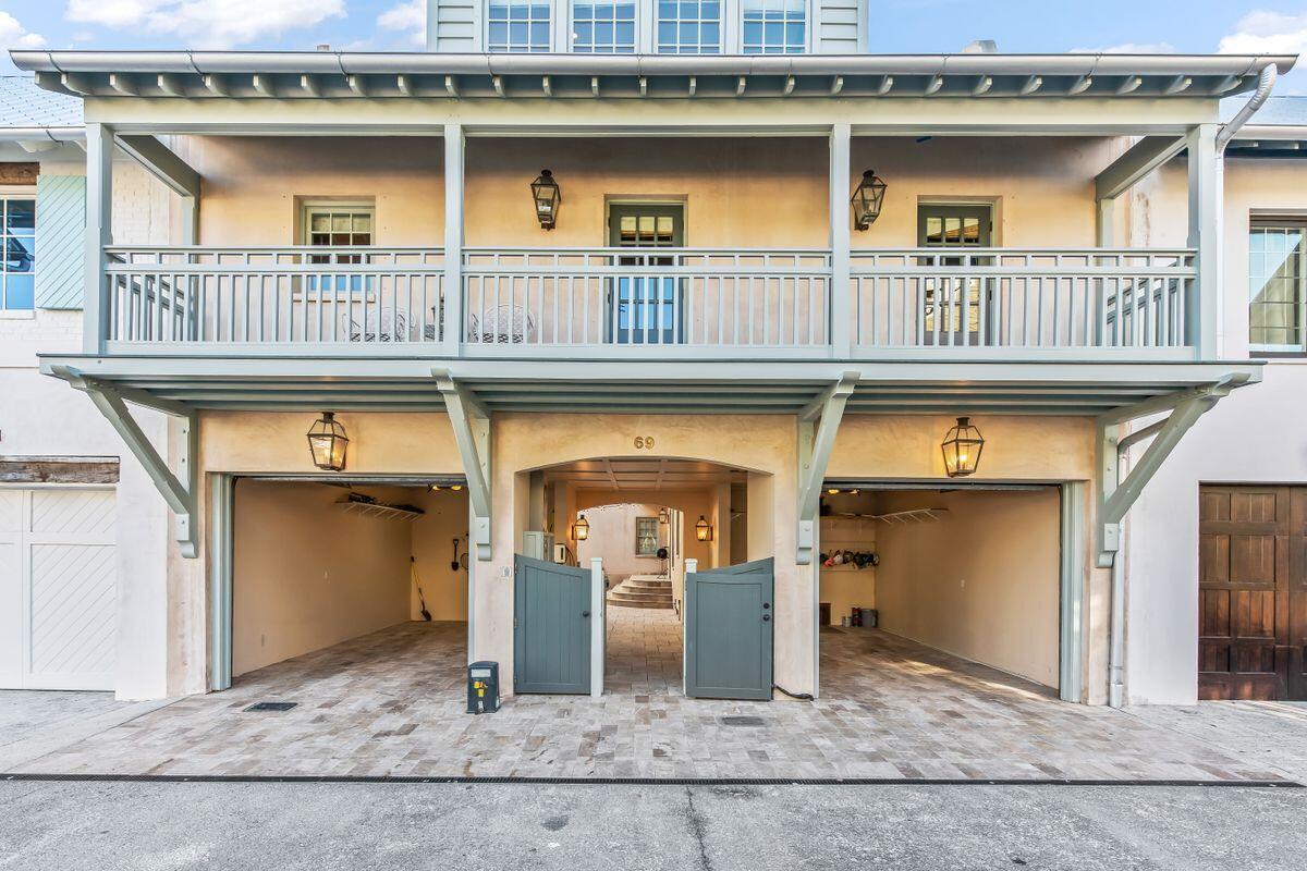 Prominently situated overlooking the iconic Cabana Pool on the Northern side of Rosemary Beach, this quintessential West Indies inspired compound style home offers a rare combination of inspiration and value, rarely found in today's New Urbanism markets.

Providing a reverse living floor plan, this three level property offers a spacious two-car garage, master suite with his and her private bathrooms, and a guest bedroom with private ensuite, all with easy ground access to the adjacent community pool and walkways throughout the town. The main level of the home also offers a charming enclosed patio with hot tub and lounge style seating, perfect for enjoying morning coffee or afternoon cocktails in a private, vegetation rich environment. The second floor of this home provides two additional guest bedrooms, each with private ensuites for the ultimate in privacy and convenience. Additionally, the gourmet kitchen provides the idyllic locale for gathering with friends and family while the culinarily minded will appreciate the 48' Viking Gas Range with double ovens, Viking refrigerator and full size freezer, and the additional convenience of an ice maker and wine refrigerator all covered in deeply luxurious Carrera Stone countertops. An informal dining space offers flexibility and togetherness with the adjacent family room providing floor to ceiling windows with picturesque nature and pool views. The second level of the property also provides a powder bath and a private deck for additional transitional living and convenience.

The charming third level is home to a spacious bonus room with bunks, as well as a private deck with swinging daybed for soaking up outdoor time under the sun. The bonus space offers flexibility to be outfitted as a second living room or enhance the bunk space into a full game or theater room.

The fifth bedroom is found in the interior access carriage home, outfitted with a full kitchen, private bath and an additional loft space with a set of full bunks and extra living space.

Notable features of the home include fresh exterior paint, a whole house generator, an electric car charging station, two tankless water heaters, all new mattresses and light fixtures throughout as well as three new HVAC systems and a remote temperature monitoring system.

Create your next favorite coastal retreat at this expansive Rosemary Beach home, perfect for use as a second home, vacation rental or your new primary living property along 30A.
