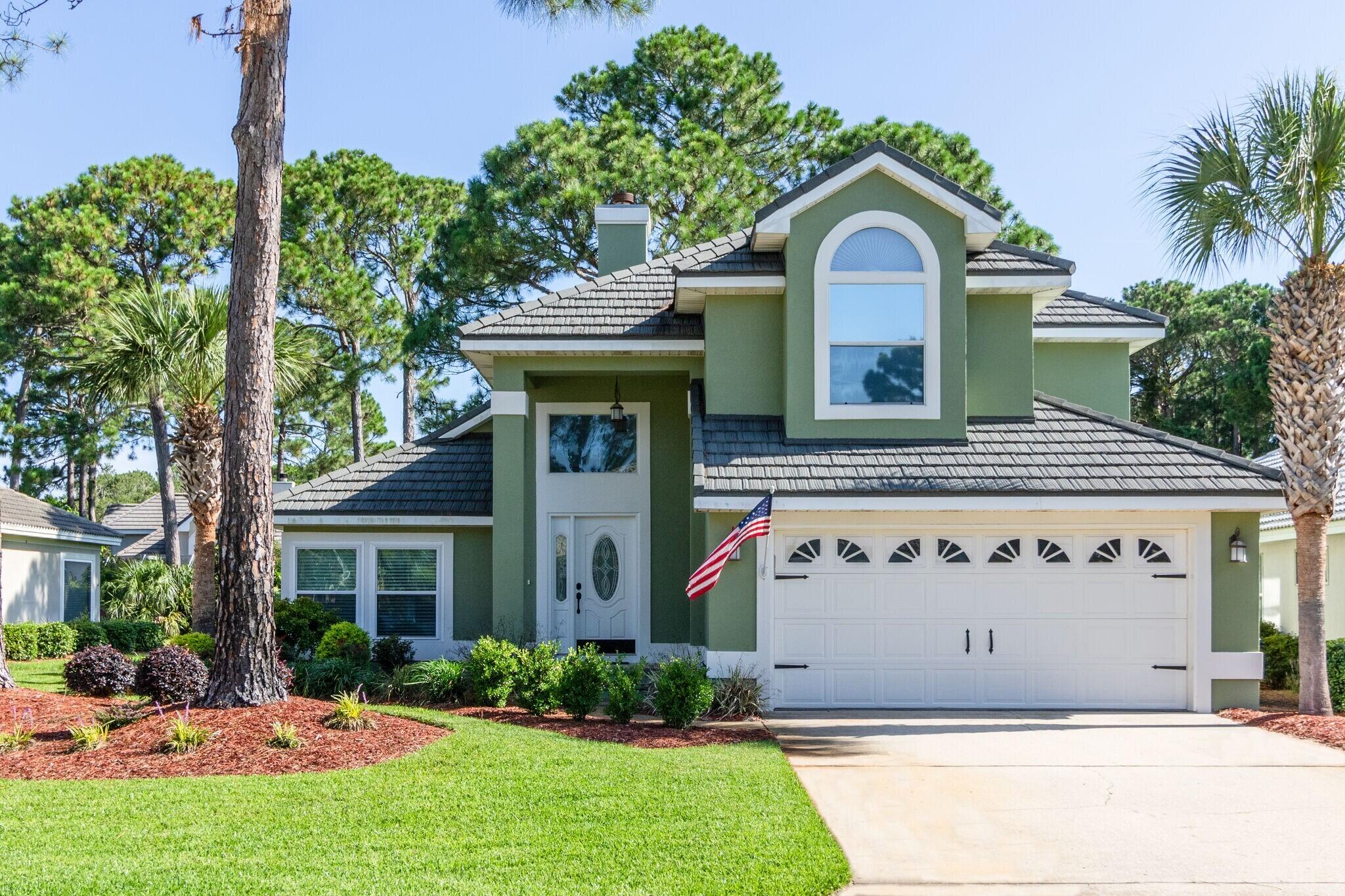 The pictures say it all! Don't miss this chance to own a beautiful home in the gated golf community of Emerald Bay. This home is in Mint Condition! Total renovation in 2019 features new custom kitchen cabinetry, all stainless steel appliances, gas stove and beautiful marble countertops. Gorgeous hard wood floors in living and kitchen areas and new carpet in bedrooms and loft. Bathrooms newly renovated. Master bathroom includes an en suite master bath w/jacuzzi jetted tub, separate shower, double vanities with marble countertops and walk-in closet. AC is 2 years old w/a Mitsubishi Splitter added upstairs keeping electric bills extremely low at $40-$50/mo and $100/mo in the summer months. 5 year old Gerard Steel roof has a 50-year warranty, is hurricane rated and impermeable to golf balls – only 1 other home in Emerald Bay has this same roof! New exterior paint. Master suite and master bath downstairs. 2 bedrooms and a huge loft upstairs.  Laundry room w/custom cabinets. Enjoy entertaining on the screened porch overlooking a private lagoon and wooded area.