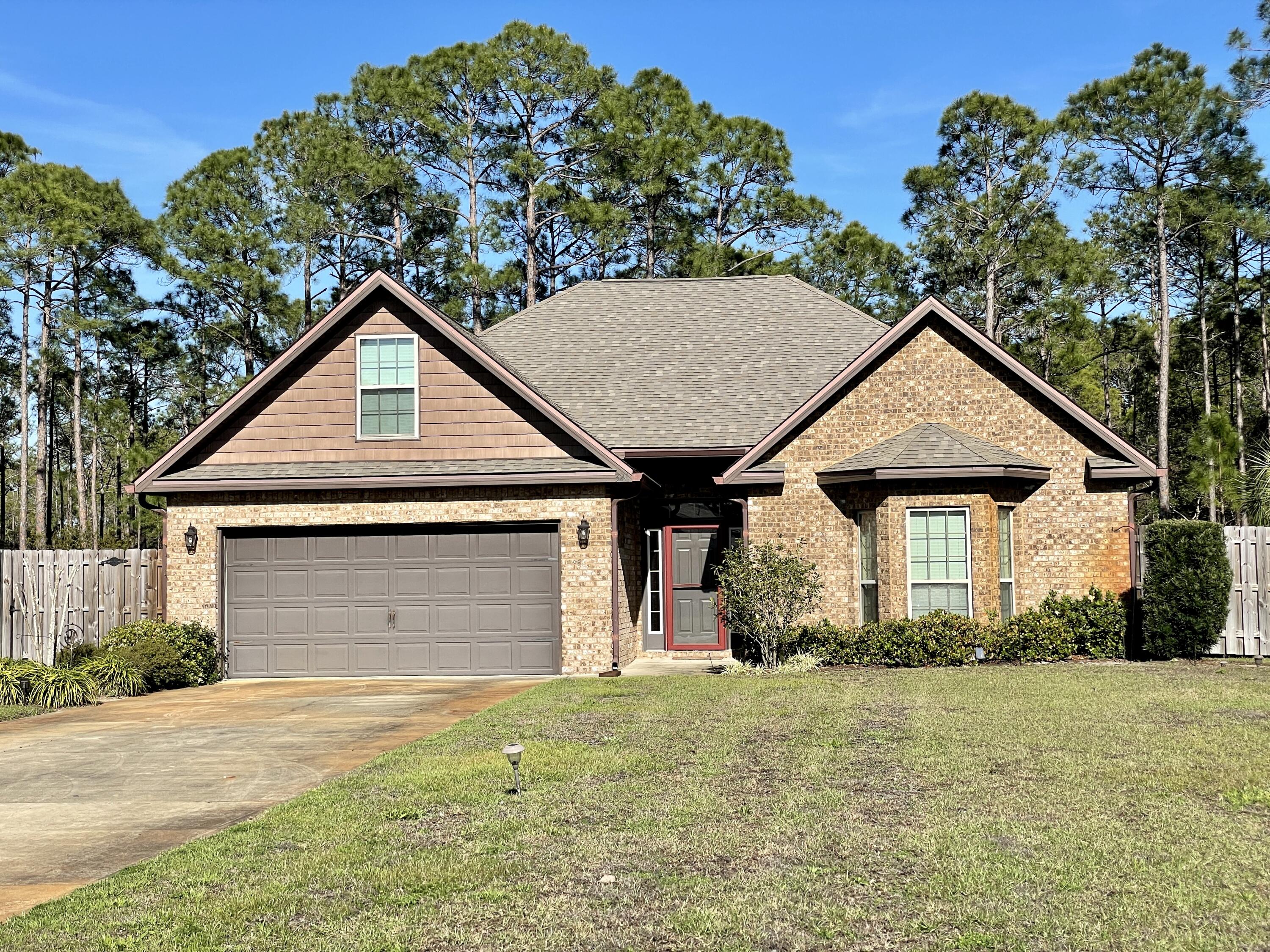 Stunning 4 bedroom/2 bathroom brick home located in desirable location of Driftwood Estates just off Mack Bayou Road.  Expansive front yard with lots of parking.  Enter into a spacious foyer with archway into the living area.  Open floor plan allows for entertaining and family gatherings.  Living area features french doors opening to a sunroom/bonus room/playroom - multi-purpose room and through to the screened patio. Kitchen features granite countertops and spacious breakfast bar along with stainless appliances. With a split bedroom floor plan you have 2 bedrooms in the front of the home and the master in the back.  Master bedroom en-suite includes double vanities, large soaking tub and separate shower.   Upstairs is a nice additional bedroom/bonus room/office/multi-purpose room.   New outside air conditioning unit 5/2022.  Large, fenced, backyard backs up to preservation area.  Owners in Driftwood Estates enjoy a fun playground and community pool all conveniently located to hospital, restaurants, shopping and the beautiful beaches of South Walton.