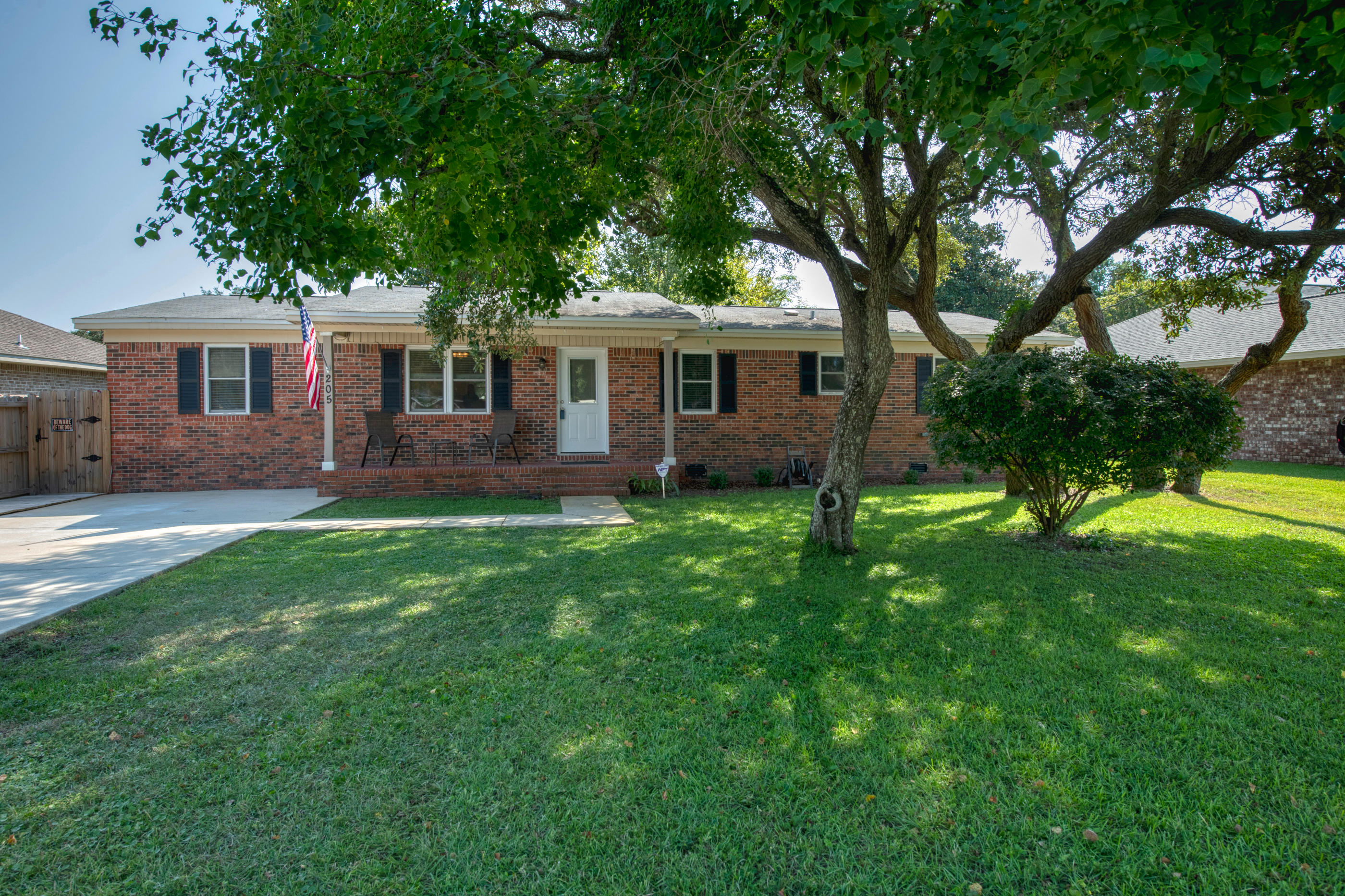 Completely Renovated! Single story brick house w/ open concept living area. Home renovation included new LVP flooring, stainless steel kitchen appliances, granite counter tops, new cabinetry in kitchen and bathrooms, and updated electrical wiring. Bonus room has exposed brick stairs that adds to the charm of this home. Indoor laundry room. Screened-in back porch has new wood decking which provides a nice walkway down the side of the house. New HVAC system installed in 2018. Out back in the large, shaded backyard is a huge shed w/ roll up garage door and side door entrance. It's the perfect spot for a home gym, workshop, or both. Shed has over 25 electrical outlets! Oversized driveway. House comes w/ custom hurricane boards w/ clips, termite bond with Terminix and security system.