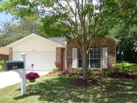 This gated community home seems perfect in so many ways. The open floor plan has high ceilings in the living room as well as welcoming views to the porch and back yard. The impressive pillared back porch opens to a manicured and shaded private back yard. Bedrooms are split for the master suite's privacy and the master bath has 2 walk in closets. The upkeep is the best, clean and with recent carefully done updating of quartz counter tops and cabinetry. It is in a perfect gated location of the Bluewater Bay area, close enough to get where you need to be quickly, but out of the way enough for quiet, peaceful living. Across the street is a manicured nature sidewalk with a pavilion and benches, perfect for reading or relaxing. Come take a look at this home today.