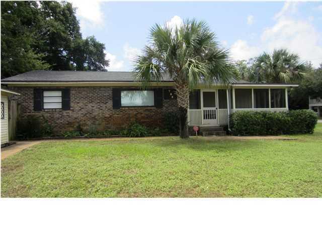 A rare find! Must see to appreciate! Large corner lot, home sits 100 yards from Joe's Bayou boat ramp and Mattie Kelly Park and Nature Walk. This all brick home with Japanese Cherry wood laminate flooring, tile in kitchen and baths, new sheet rock walls with Spanish lace finish. This split bedroom floor plan has updated electric and plumbing, large screened front porch, detached garage, sprinkler system, and gazebo in back yard. Brand new AC system!!