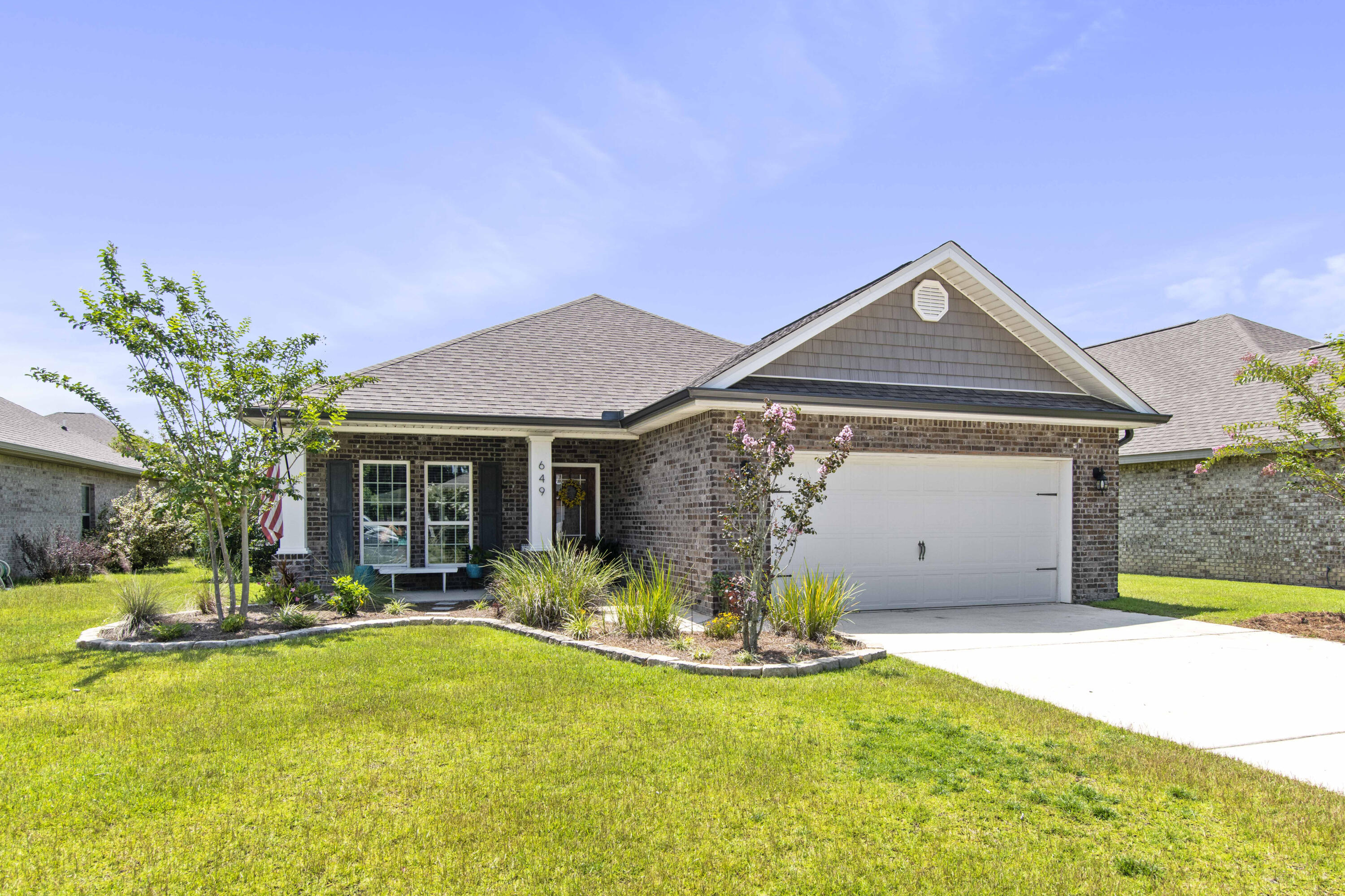 Welcome home to 649 Cocobolo Drive, a stunning one-story brick home nestled within the sought-after Driftwood Estates, a charming bayfront community in beautiful Santa Rosa Beach, Florida. This immaculate property presents an incredible opportunity for those seeking a comfortable and modern coastal lifestyle in an amazingly friendly neighborhood. With 4 bedrooms and 2 full bathrooms, this home offers ample space and flexibility. The 4th bedroom would work as an excellent home office space. The recently updated interior boasts a seamless blend of contemporary design and coastal charm, creating an inviting atmosphere as soon as you step inside. The heart of the home is a spacious and open living area, perfect for entertaining guests or spending quality time with loved ones. Natural light pours in through large windows, enhancing the airy and bright ambiance. The well-appointed kitchen features a large island, modern stainless appliances, granite countertops, glass tile backsplash and ample storage, making it a delightful space for culinary enthusiasts. Step outside onto the private covered patio, where you relax an enjoy the warm Florida nights and outdoor gatherings with friends and family. The large backyard provides a peaceful retreat, where there's plenty of room to create your dream outdoor oasis. Home also has a spacious two-car garage with abundant storage in and above in the attic space. Living in Driftwood Estates means enjoying an array of exceptional amenities that cater to every lifestyle. Take a refreshing dip in the expansive community pool on hot summer days, or explore the scenic walking trails winding through the community's lush landscapes. For families, the playground offers a safe and enjoyable space for children to play or indulge in a delightful outdoor barbecue at the pool on a charcoal grill where you can savor meals under the picnic pavilion. Beyond the community, you'll discover the enchanting allure of Santa Rosa Beach, with its pristine sandy shores and turquoise waters just a short distance away. Explore the many local shops, restaurants, entertainment options, and grocery store of Grand Boulevard at Sandestin. Additionally, Ascension Sacred Heart Hospital is just a few miles away. Don't miss this chance to make 649 Cocobolo Drive your new home. With its modern updates, ideal location, and the fantastic amenities of Driftwood Estates, this property won't stay on the market for long. Schedule your private showing today and experience the ultimate Florida coastal living at its finest! Buyer to verify all dimensions and information.