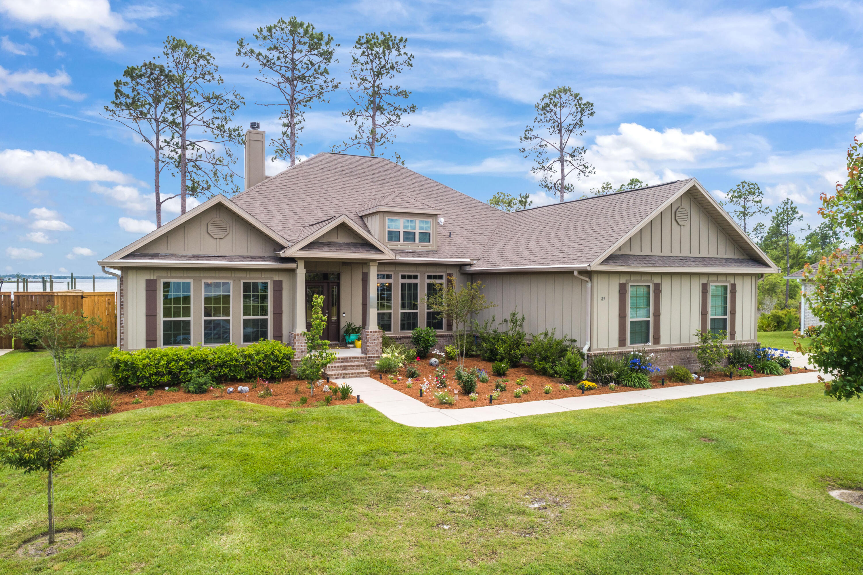 This exceptional WATERFRONT Fanning Bayou Estate home answers the question ''Why Move to Florida?''! Built in 2017 with many custom high-end finishes and upgrades, this 4BR/3BA home overlooks Newman Bayou and includes a boat dock with 10,000 lift and you have bay and gulf access! The floor plan includes split-bedrooms, formal dining room, office/study, and a sun room that offers a beautiful view of the water. A well appointed kitchen including stainless steel appliance, granite countertops, gorgeous backsplash, and a breakfast nook, adjoins the expansive Great Room with fireplace and double tray ceiling and crown molding. The master suite also has a tray ceiling and the bath includes double sinks, soaking tub, separate shower and a California style closet system. The expansive back deck is ideal for entertaining since it has a built-in TV, has a great covering and offers a gorgeous backdrop of the bayou. A two car garage with additional storage means you can access your holiday decor without always having to go into the attic! This is a dream home and words and pictures cannot adequately describe it, you must SEE it for yourself! All info is approx and must be verified by Buyers if important.